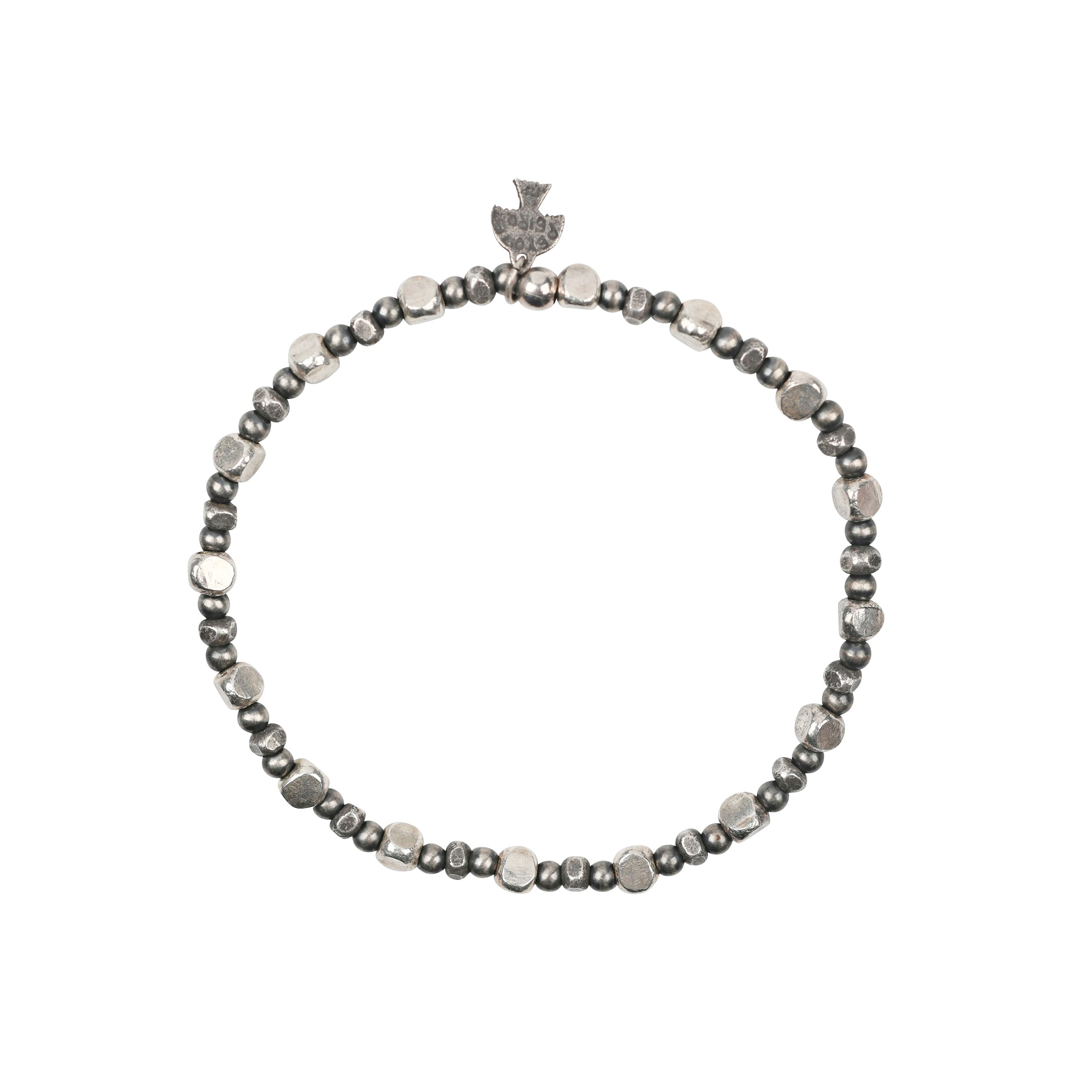 A pair of stretch bracelets strung with Desert Pearls, Geometric Beading, topped with a dash of Turquoise.