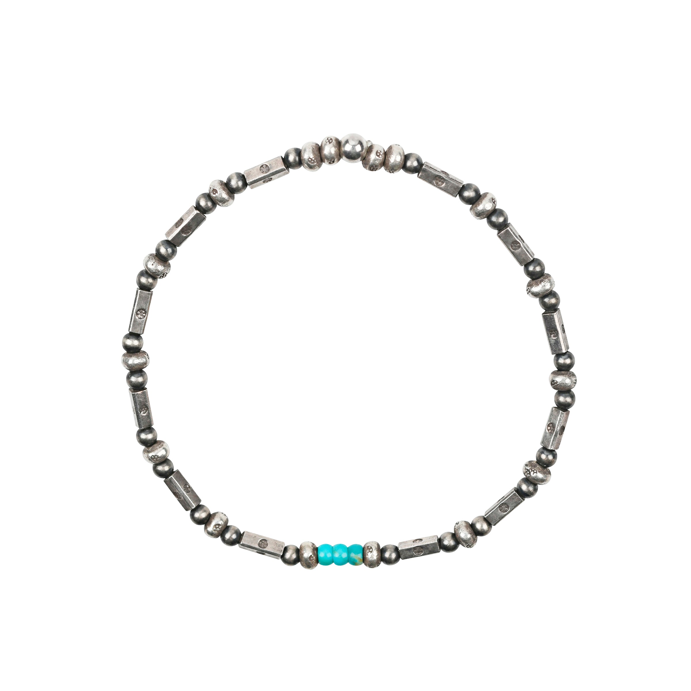 A pair of stretch bracelets strung with Desert Pearls, Geometric Beading, topped with a dash of Turquoise.