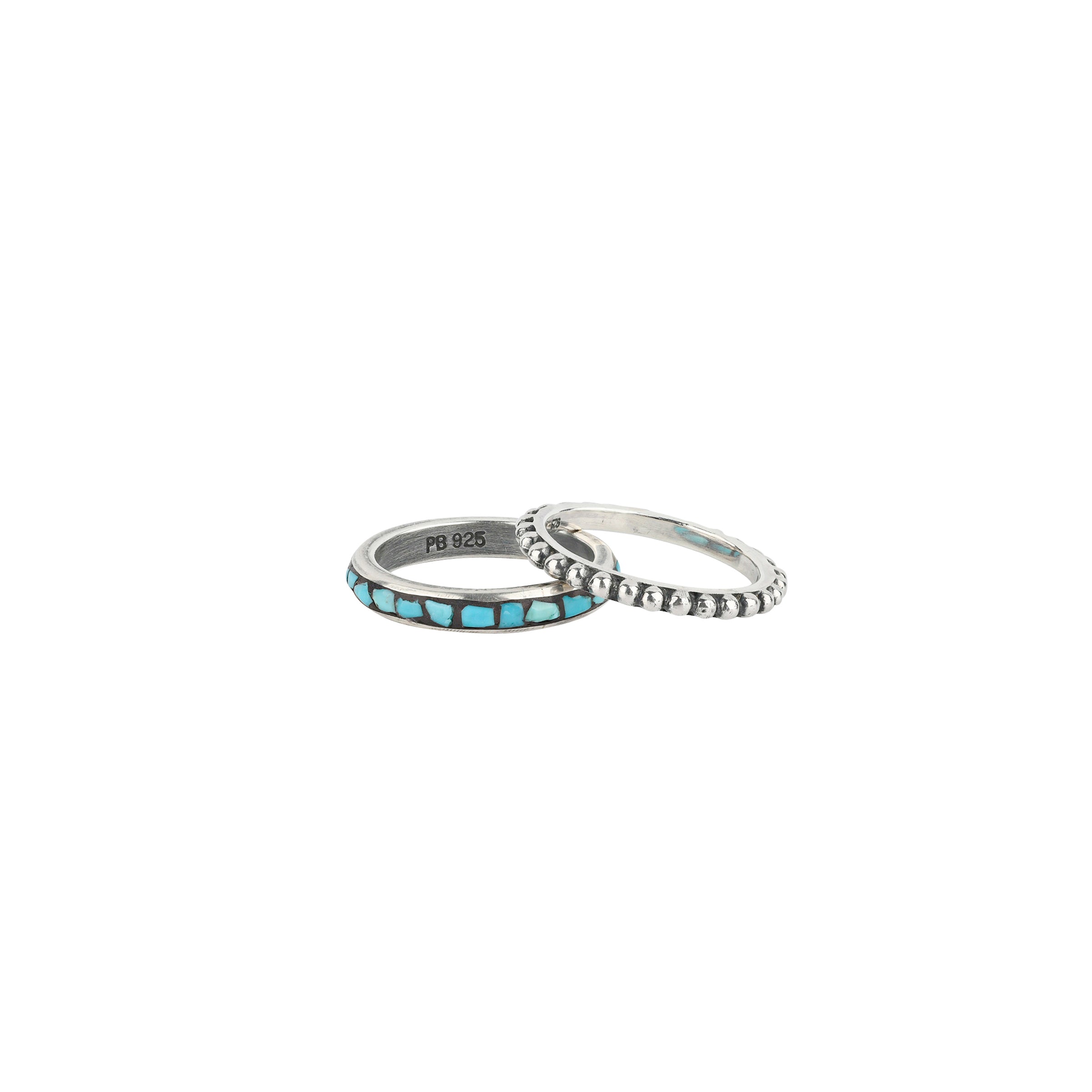 A set of Sterling Silver rings, one ring with a bubbled texture and the other features inlayed turquoise chips. As seen in the Sundance Catalog.