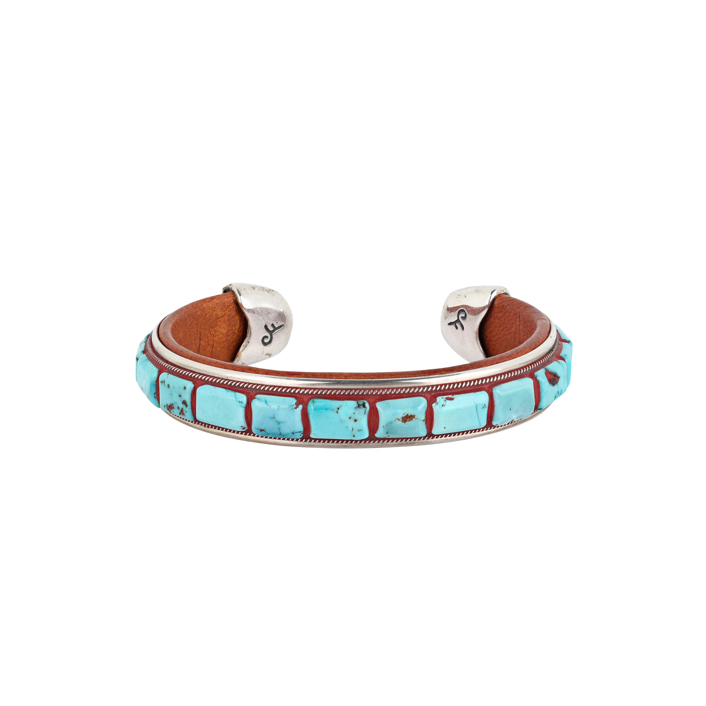 A beautifully designed cuff made of inlayed Blue Turquoise and brown leather finished with Sterling Silver tips. 