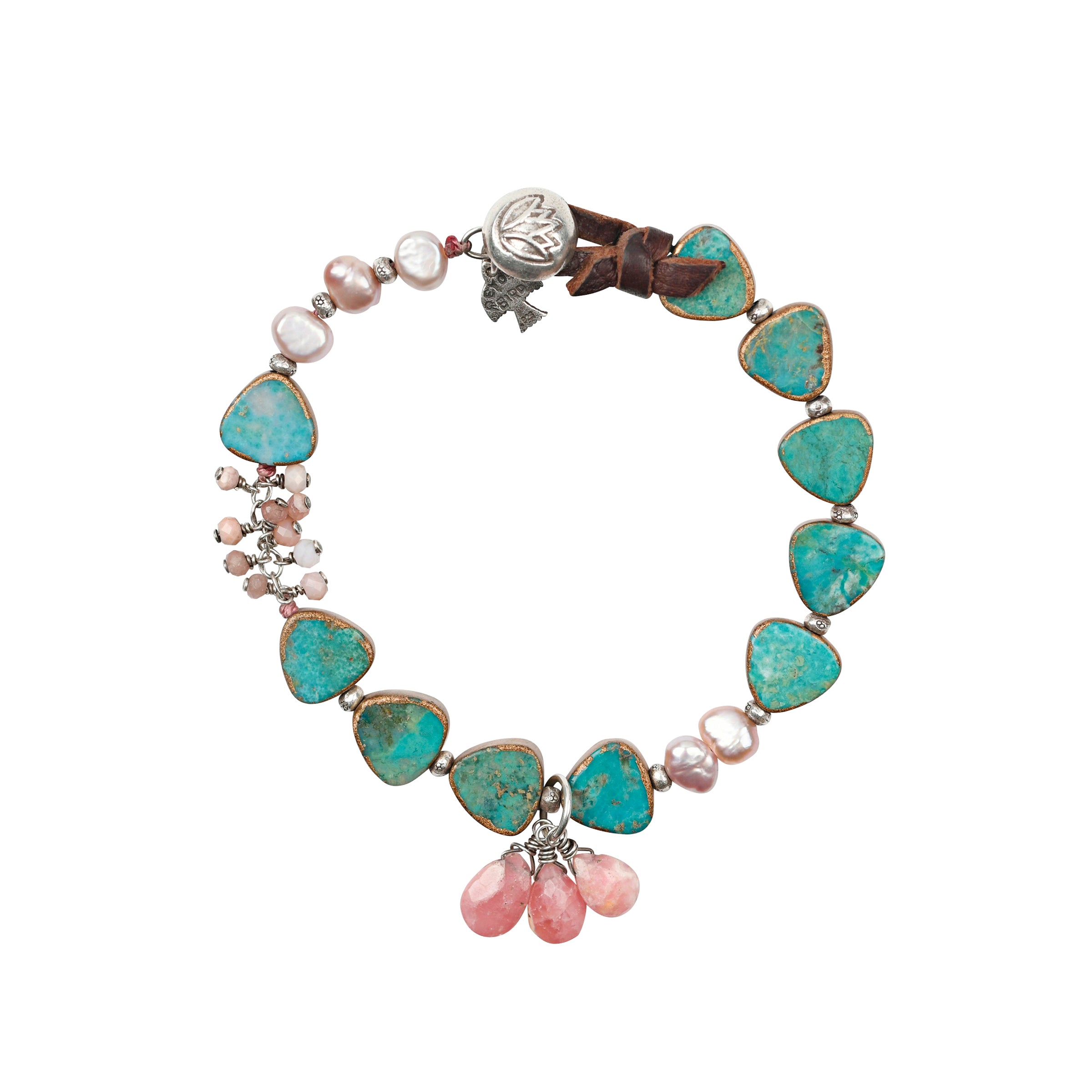The Pathfinder Bracelet was featured in the Sundance Catalog for many years. Strung with electroplated triangles of Turquoise, charms of Rhodochrosite, and accents of pink Freshwater Pearls. Finished with a loop of tied soft deerskin leather and a Sterling Silver button stamped with a lotus.