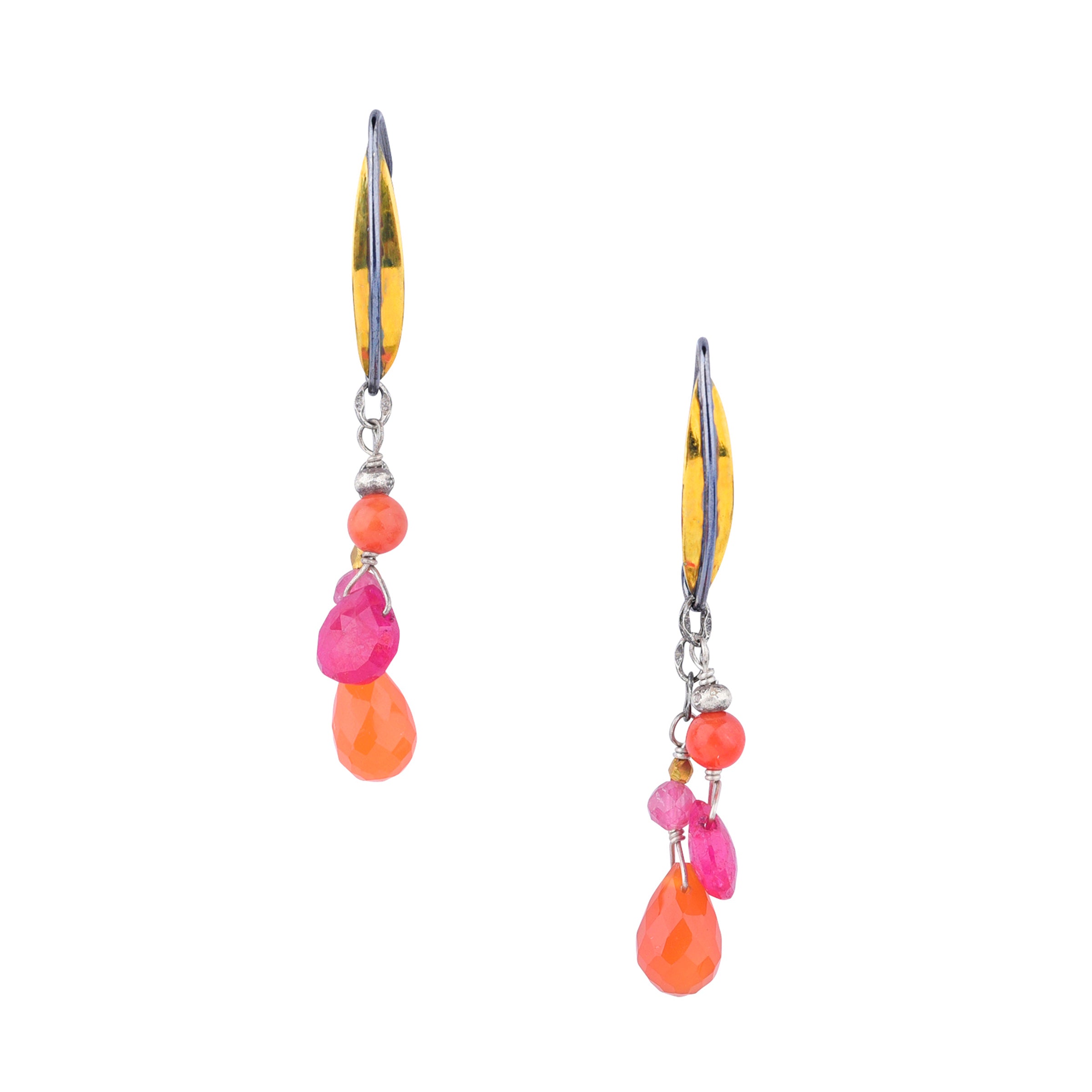 Brass and sterling silver ear wires with cascading orange carnelian and ruby earrings next to coin 