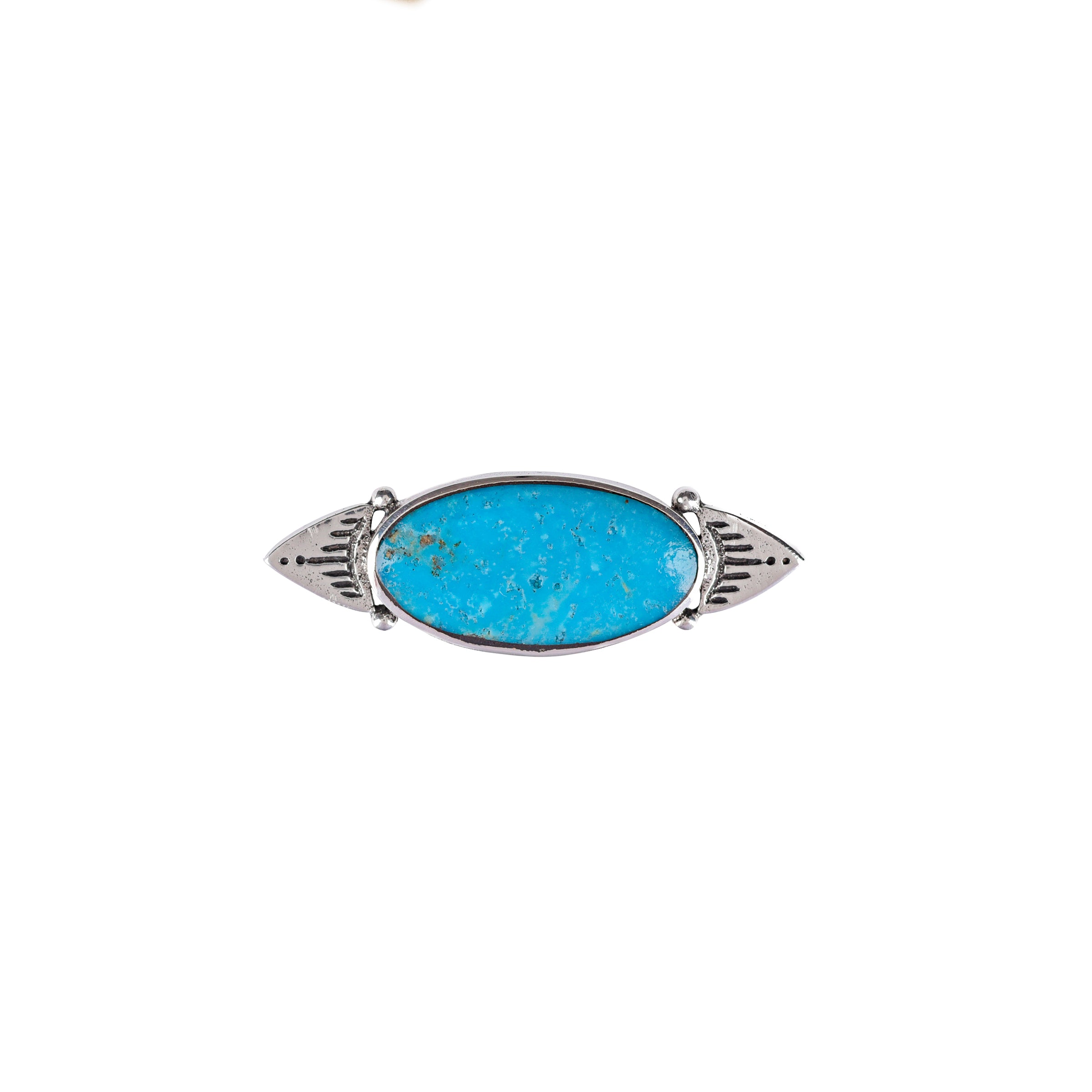 A sterling silver pin with a blue turquoise stone and intricate designs on each end.