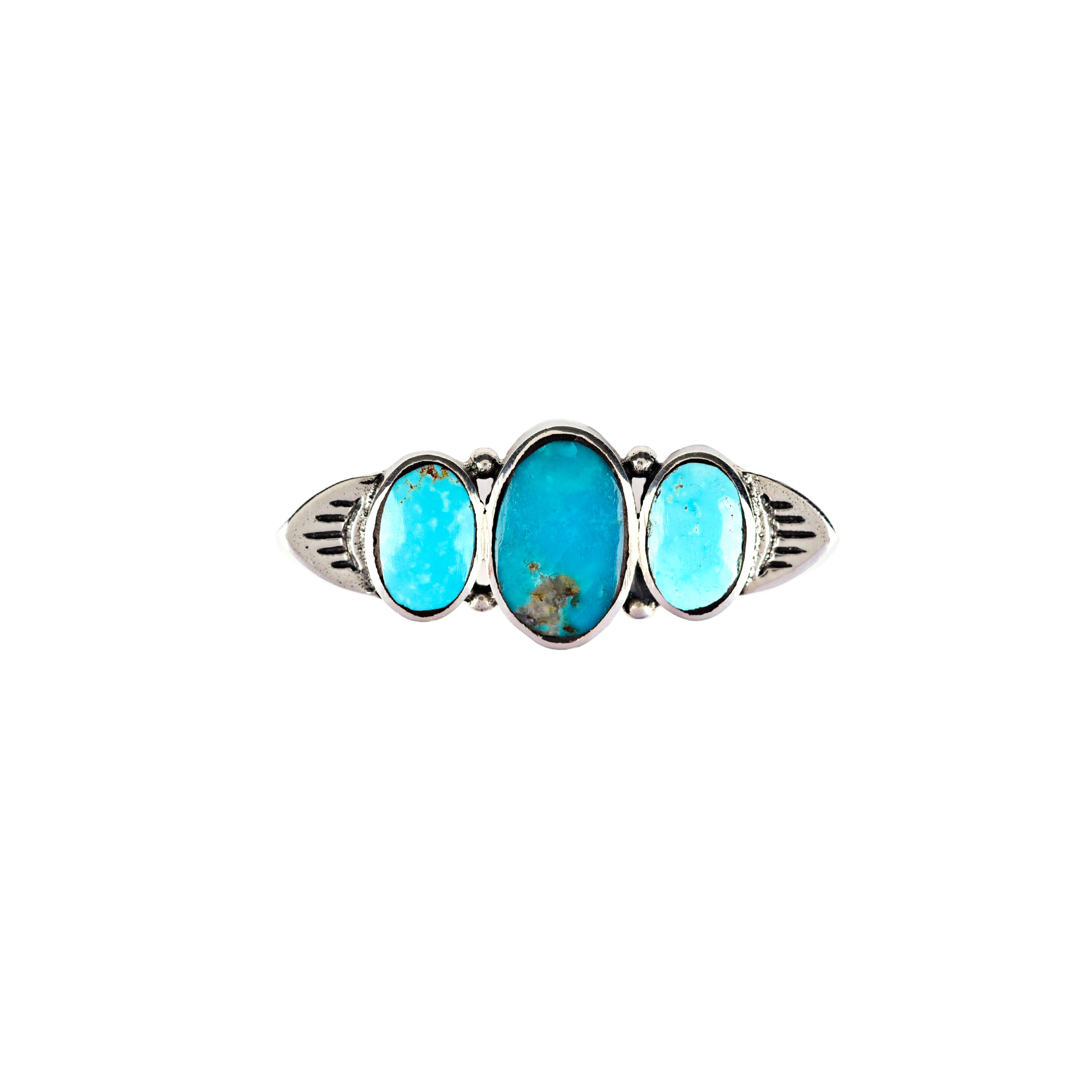 A sterling silver pin with blue turquoise inlay stones with a symmetrical design.
