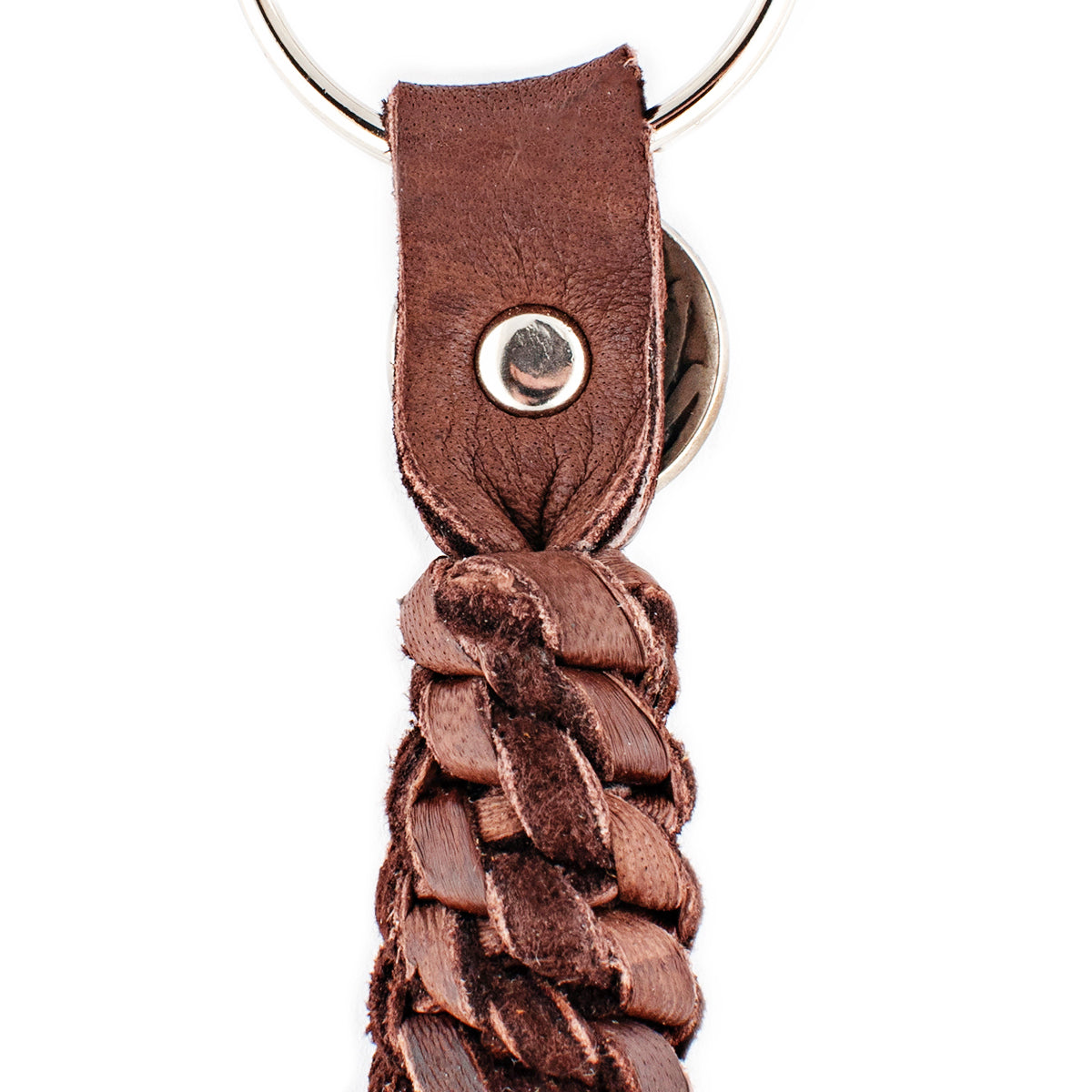 A chocolate leather tassel keychain with a silver metal key ring and a vintage buffalo nickel. 