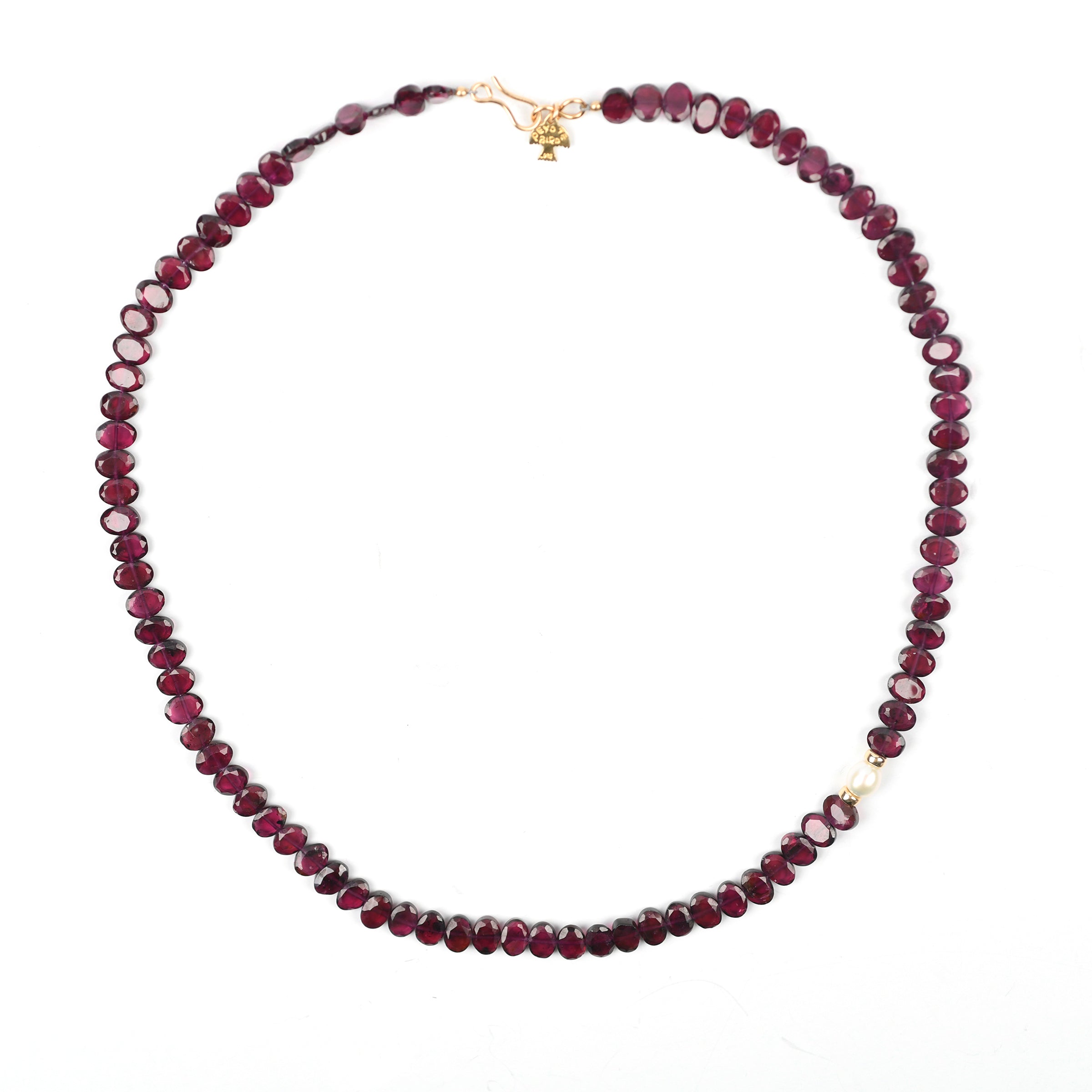 A beaded necklace strung with oval Garnets and a Freshwater Pearl as the centerpiece