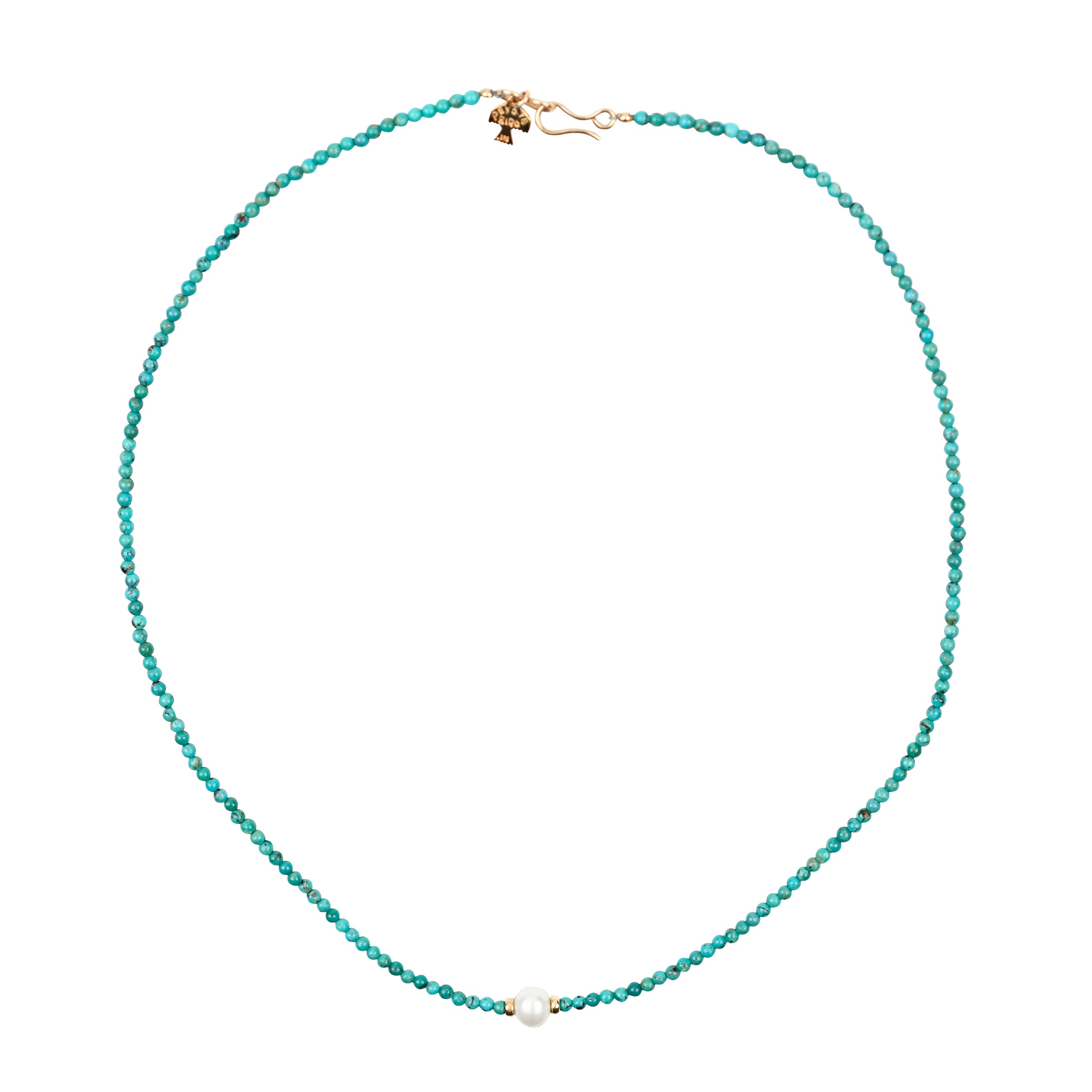 A beaded necklace that was featured in the Sundance Catalog. Strung with Turquoise beading and a singe Pearl as the centerpiece