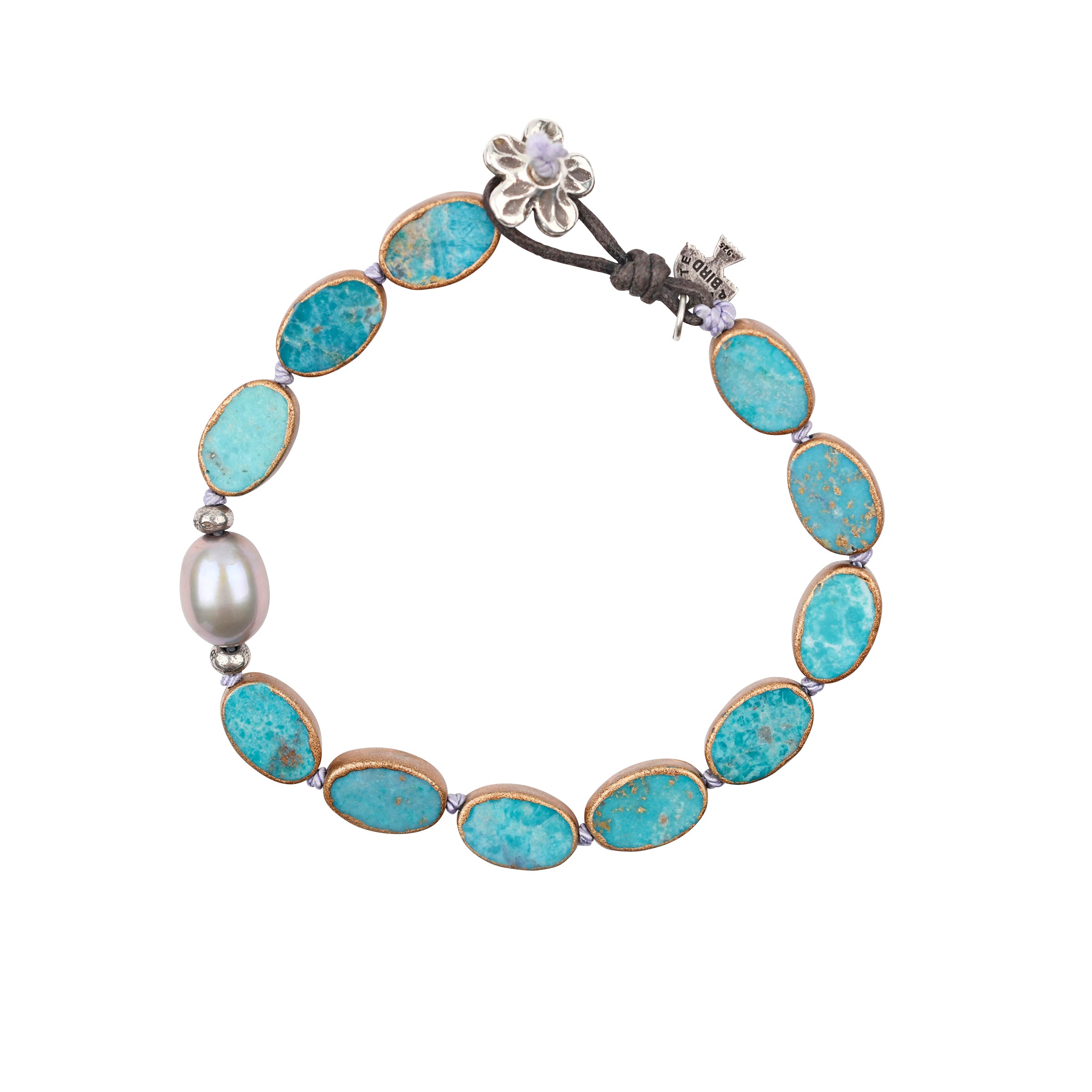 The Oasis Bracelet is a beaded heirloom strung with electroplated Turquoise and an off-center Freshwater Pearl finished with a charming floral toggle for a stylish fit.