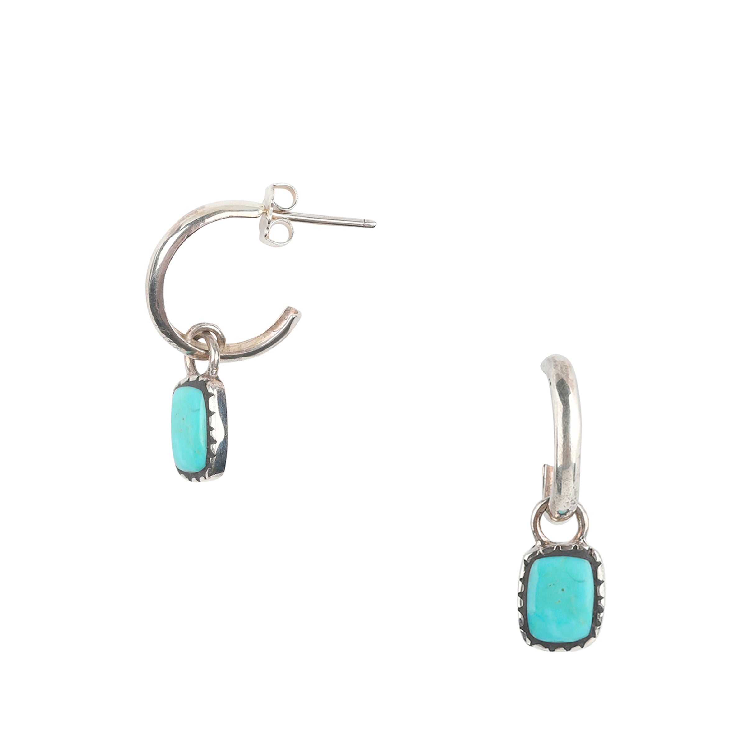 A Sterling Silver hoop earring featuring a charm of inlayed Blue Turquoise. 