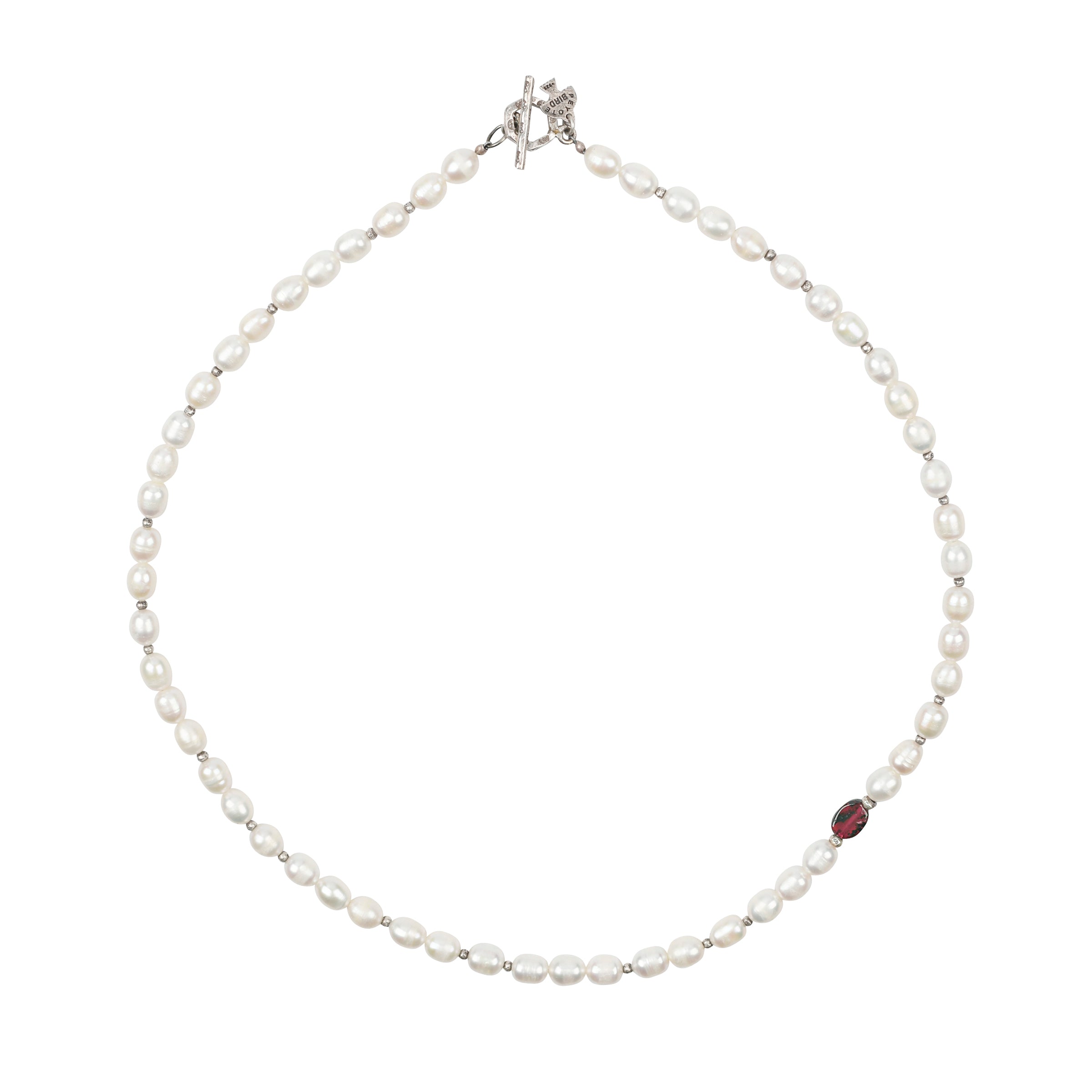 As seen in the Sundance Catalog, a beaded necklace strung with Sterling Silver, Freshwater Pearls, and a single, off-centered Garnet