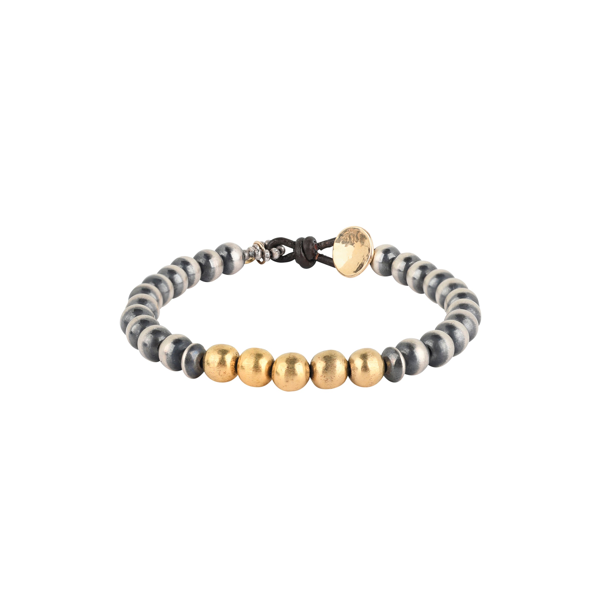 The Chiaroscuro Bracelet is strung with Sterling Silver Desert Pearls and features a row of 14k Gold Plate beading as the centerpiece.