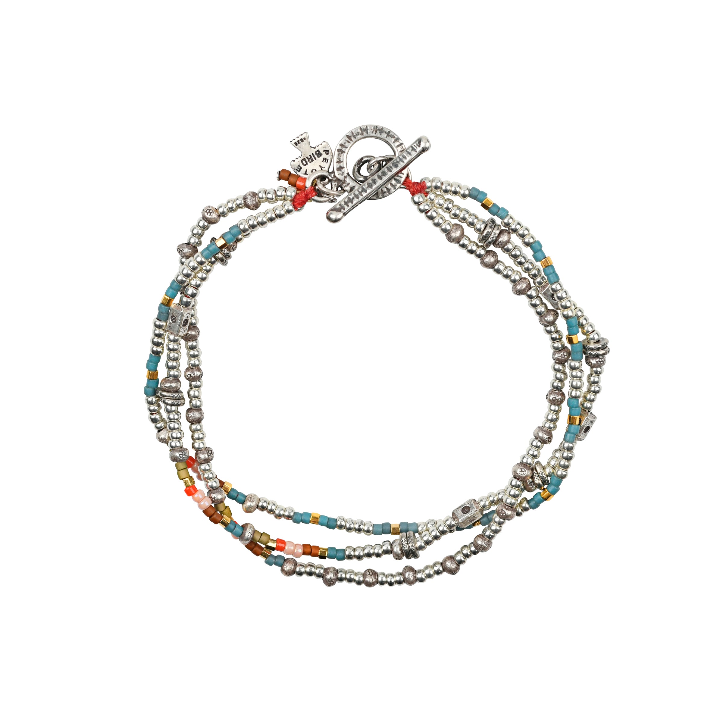 As seen in the Sundance Catalog, the Triple Playful Bracelet is a multi-strand bracelet strung with glass beading and stamped, Sterling Silver Thai beading. Finished with a bar & hoop toggle for a stylish fit.