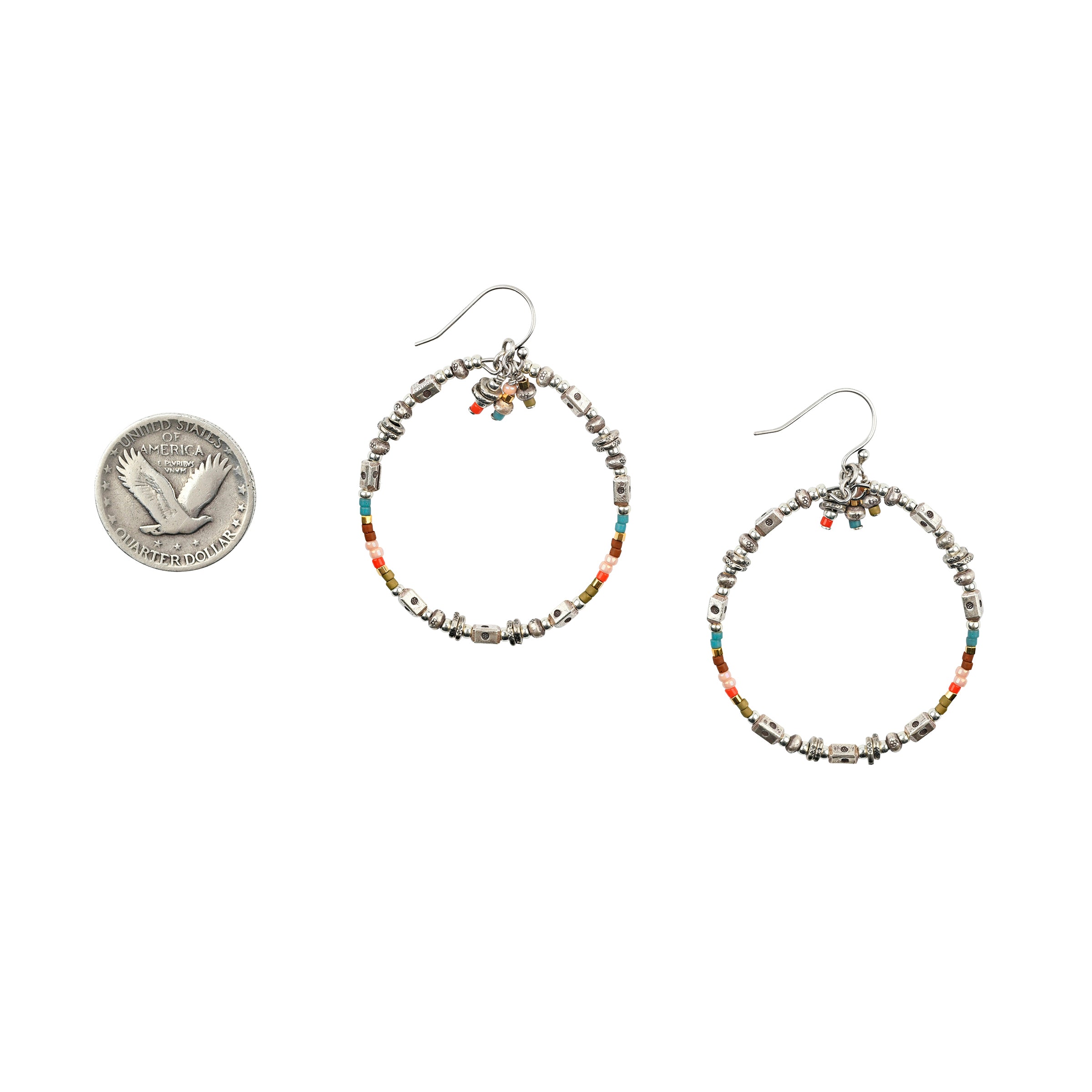 A Sundance Catalog favorite - the Triple Playful Earrings are a pair of beaded hoops featuring glass beading and stamped Sterling Silver Thai beading.