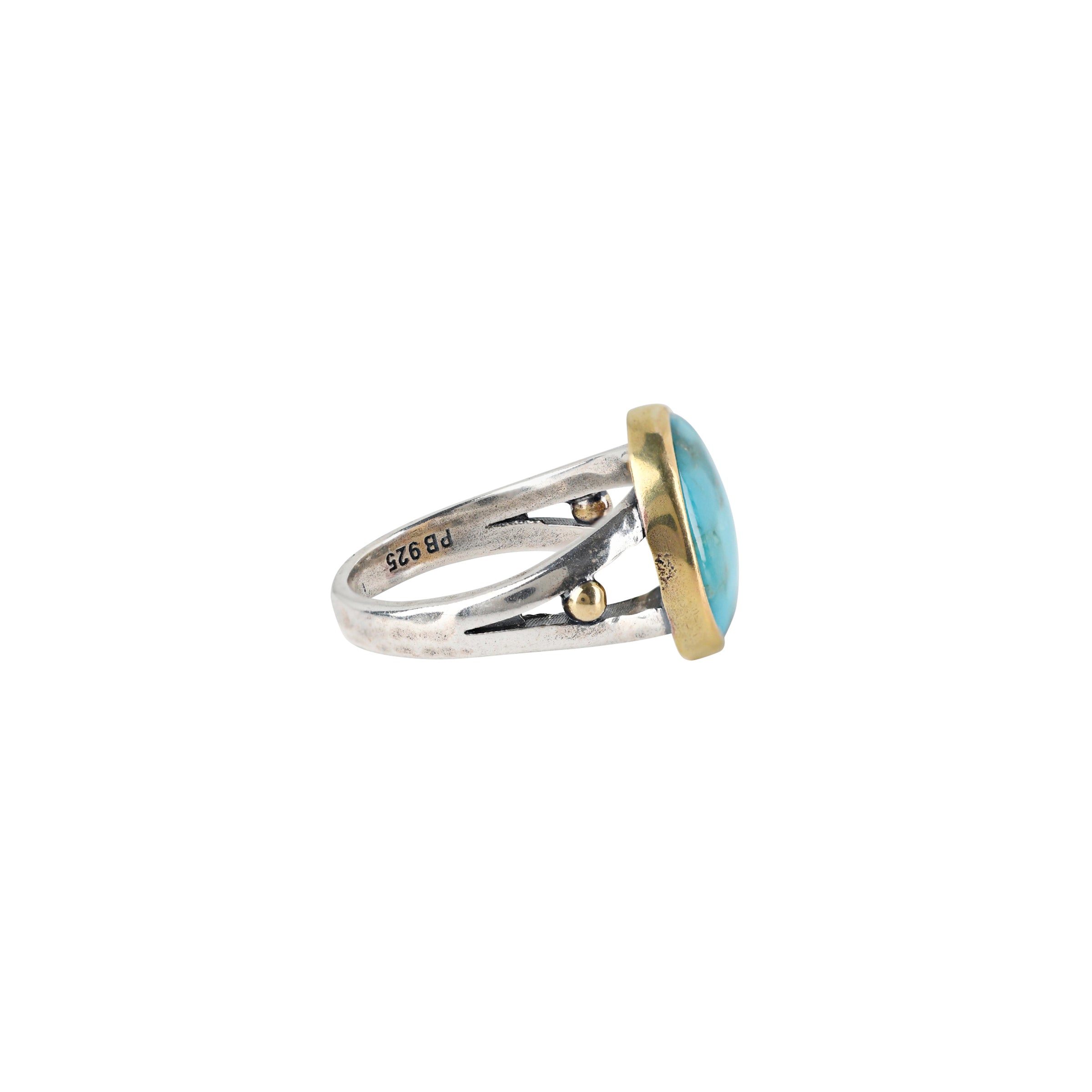 This stunning, circular  Blue Turquoise ring is made with 14k Gold and Sterling Silver. 