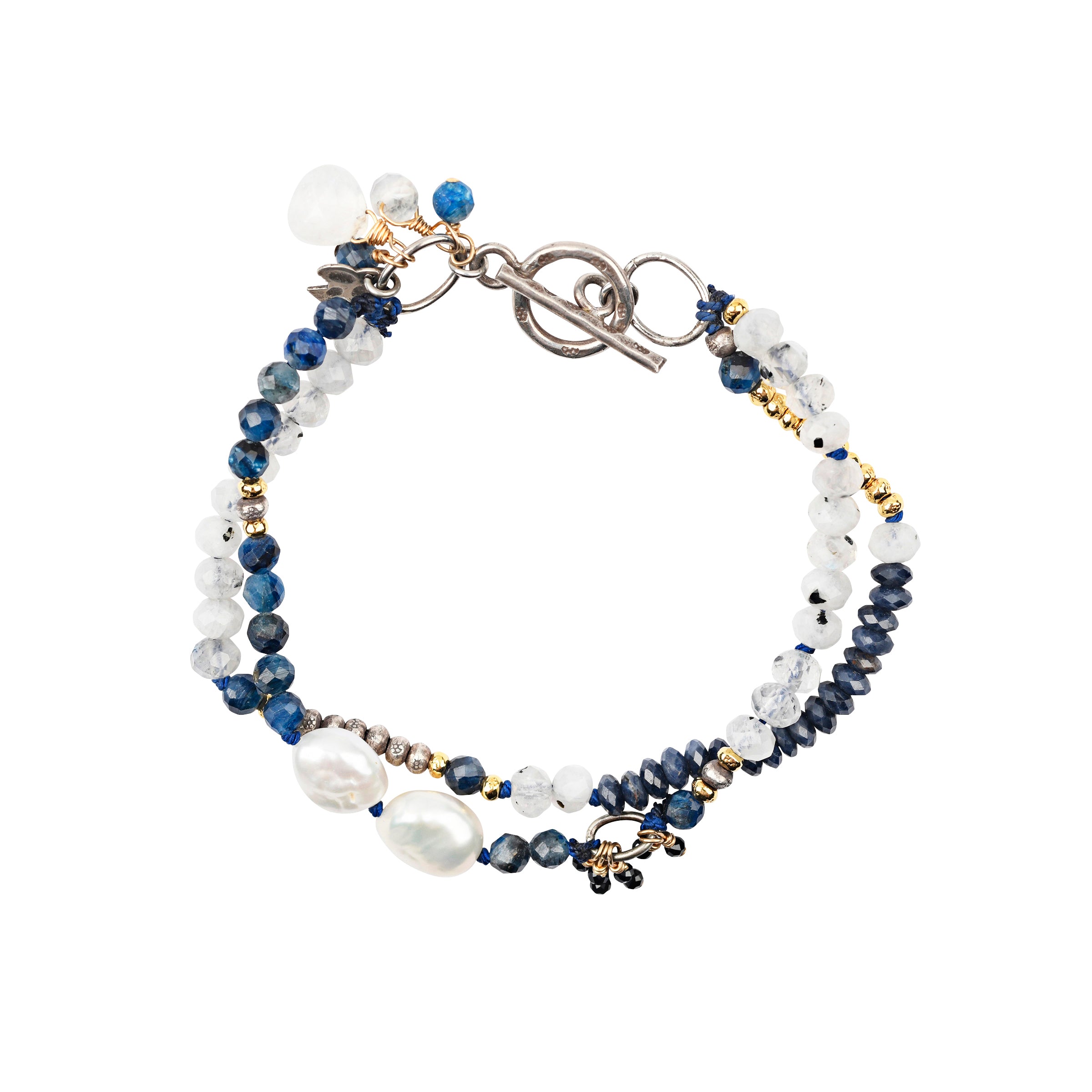 This gorgeous, multi-strand bracelet is the perfect blend of blue hues and soft white tones with 14k Gold Plate accent beading and paired with Sterling Silver. Featuring Rainbow Moonstone, Blue Sapphire, Black Spinel, Kyanite, and Freshwater Pearl.