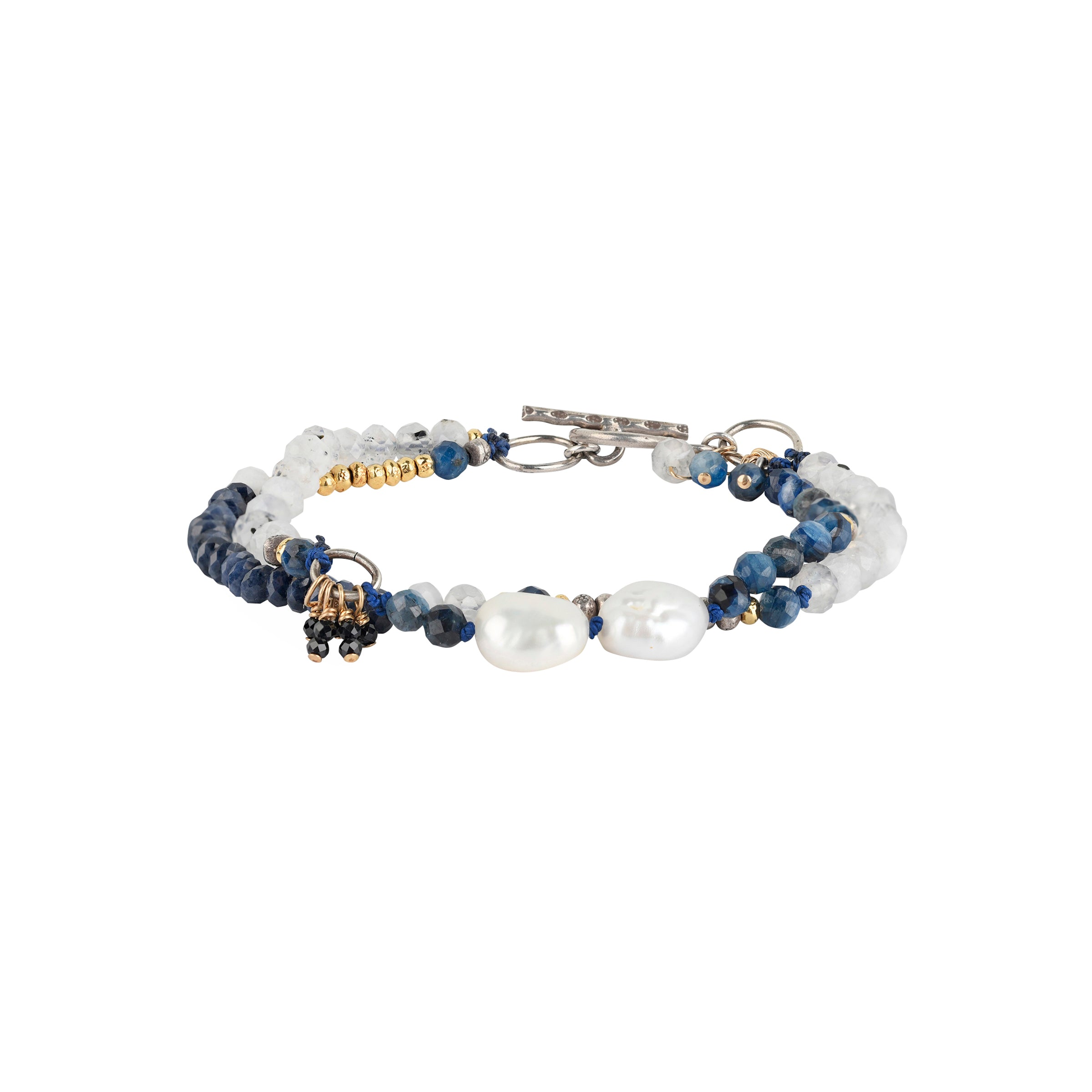 This gorgeous, multi-strand bracelet is the perfect blend of blue hues and soft white tones with 14k Gold Plate accent beading and paired with Sterling Silver. Featuring Rainbow Moonstone, Blue Sapphire, Black Spinel, Kyanite, and Freshwater Pearl.
