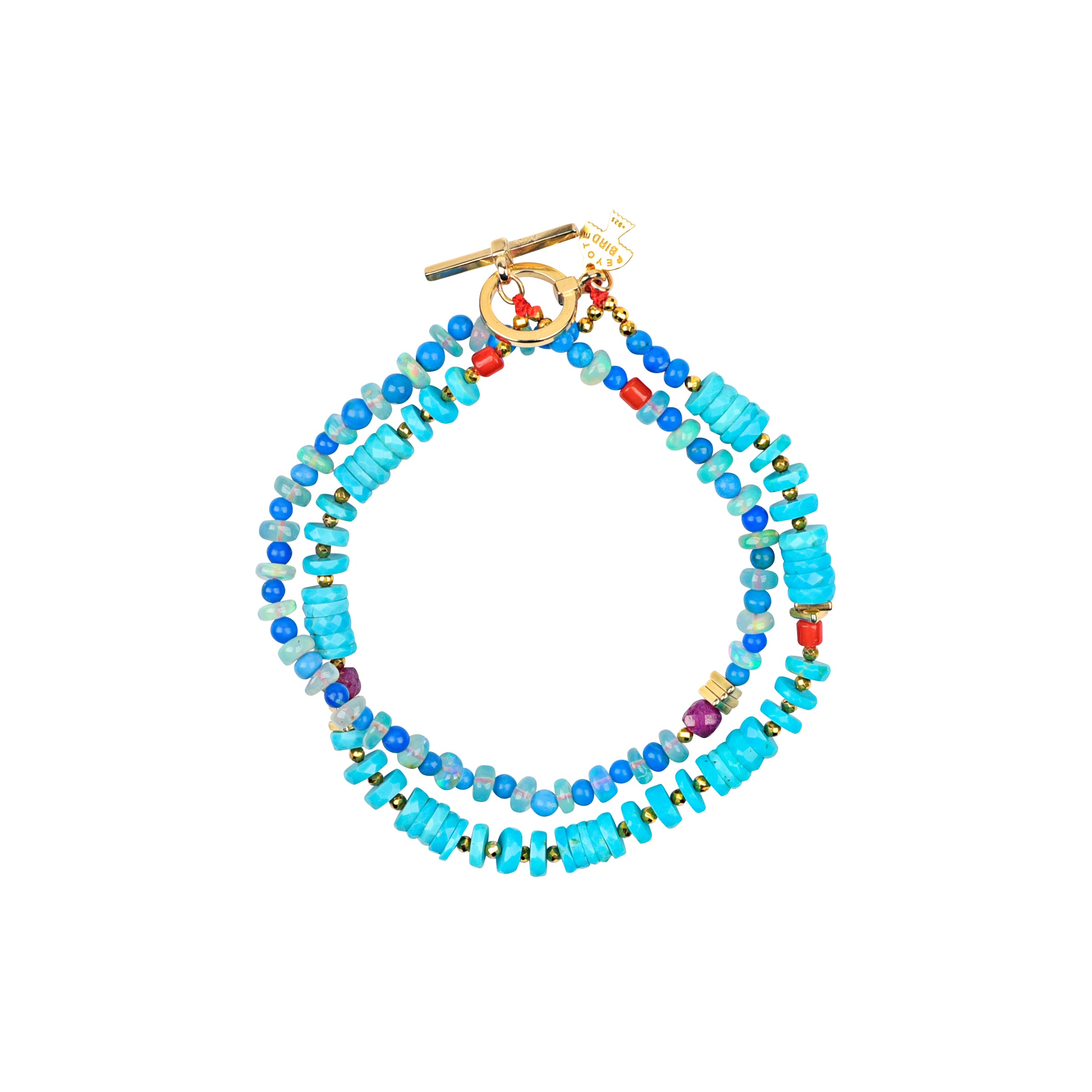 Two strand turquoise with accent beads beaded bracelet and gold toggle closure. 