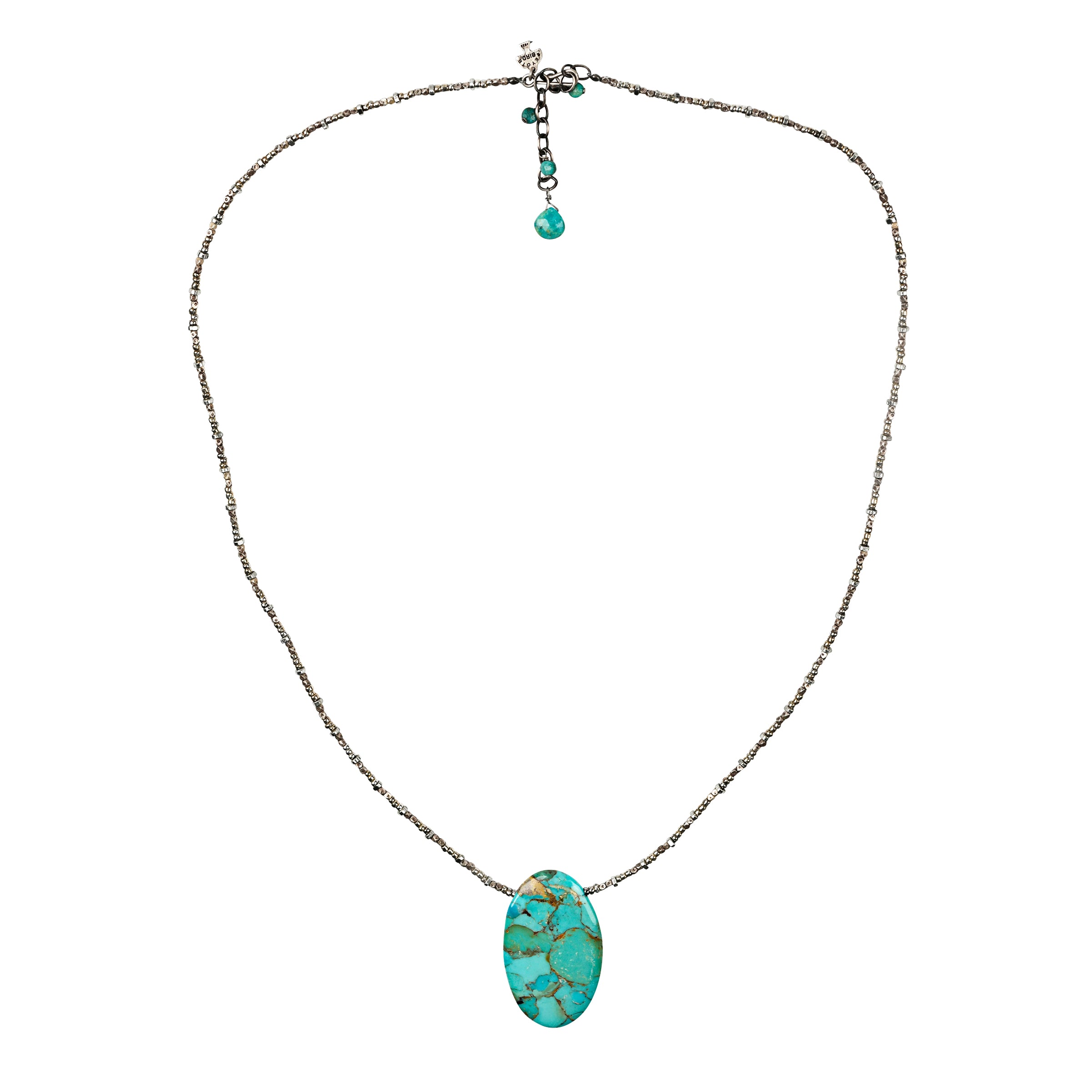 A thoughtfully beaded necklace strung with small Sterling Silver and Glass beading featuring a large oval Turquoise pendant as the centerpiece.