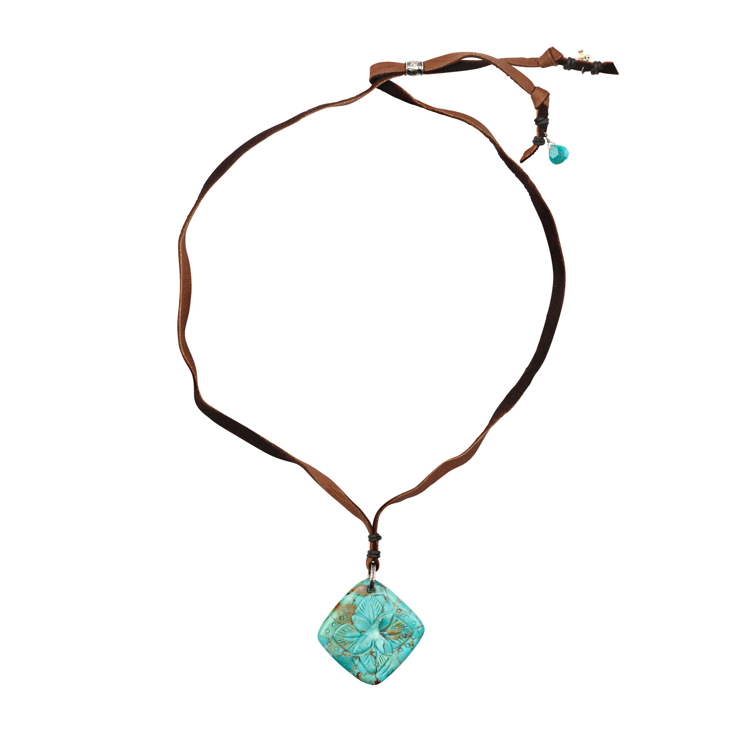 Carved Turquoise Pendant strung on soft deerskin leather finished with a Sterling Silver slider for an adjustable fit