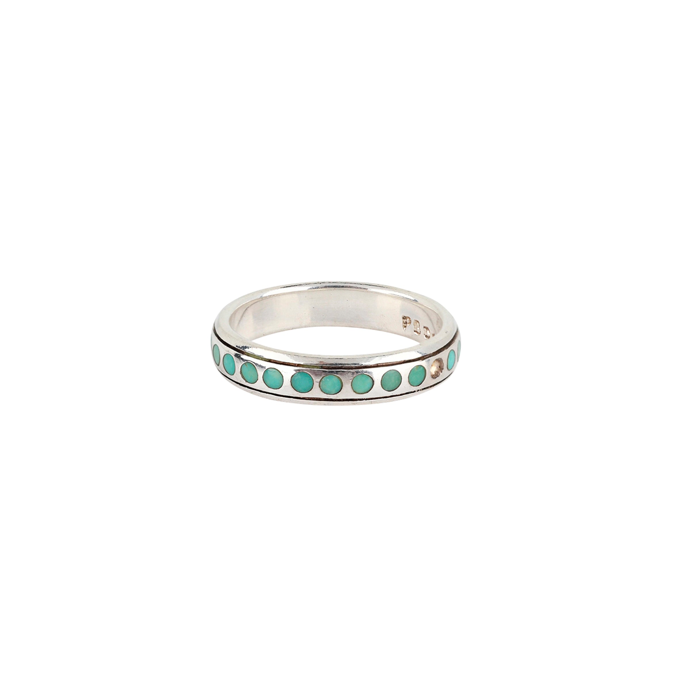 This set is comprised of three rings, meant to be stacked in any combination. Featuring a dotted Sterling Silver band with inlayed Turquoise, a plain Sterling Silver band, and finally a textured 14k Gold Plate band.