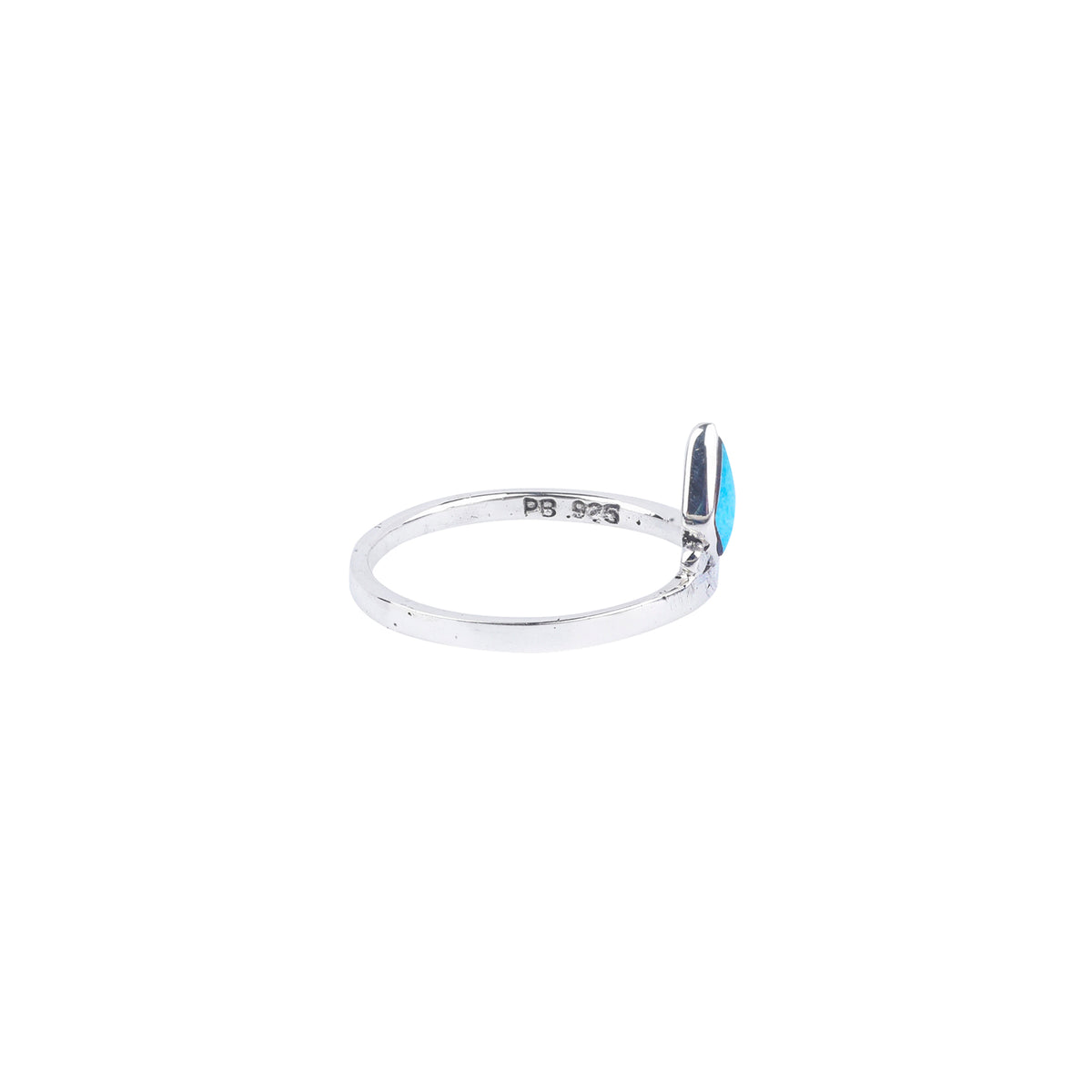 A sterling silver ring with a blue turquoise inlay in the shape of a diamond and a thin silver band.