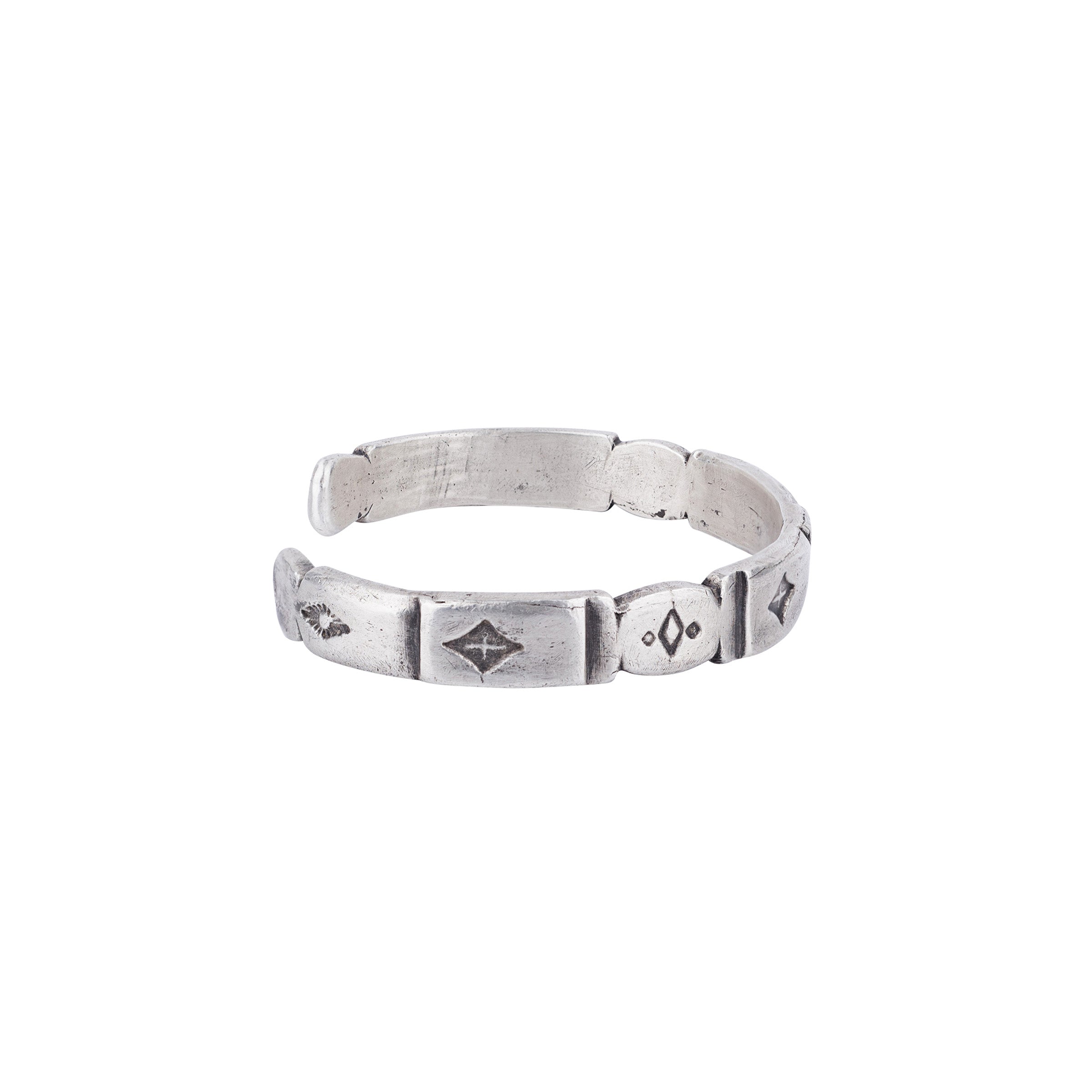 A sterling silver cuff bracelet from Aldrich Art with a patterned design, featuring a 1.5 inch opening and .25 inch width. 