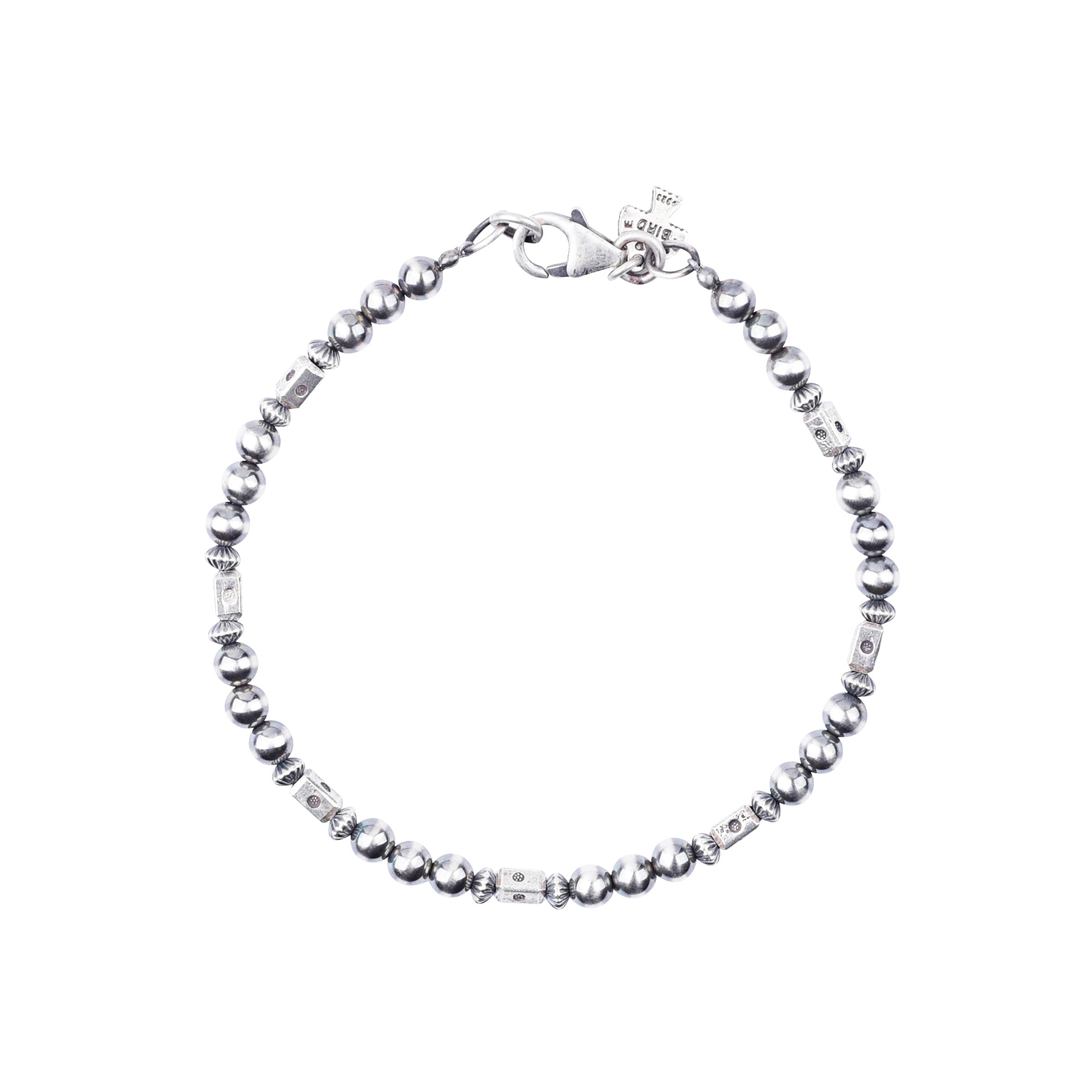 Our O'Keeffe Bracelet is adorned with desert pearls, sterling silver embellishments, and your choice of coral, pearl, or turquoise beading, or stick with just sterling silver!