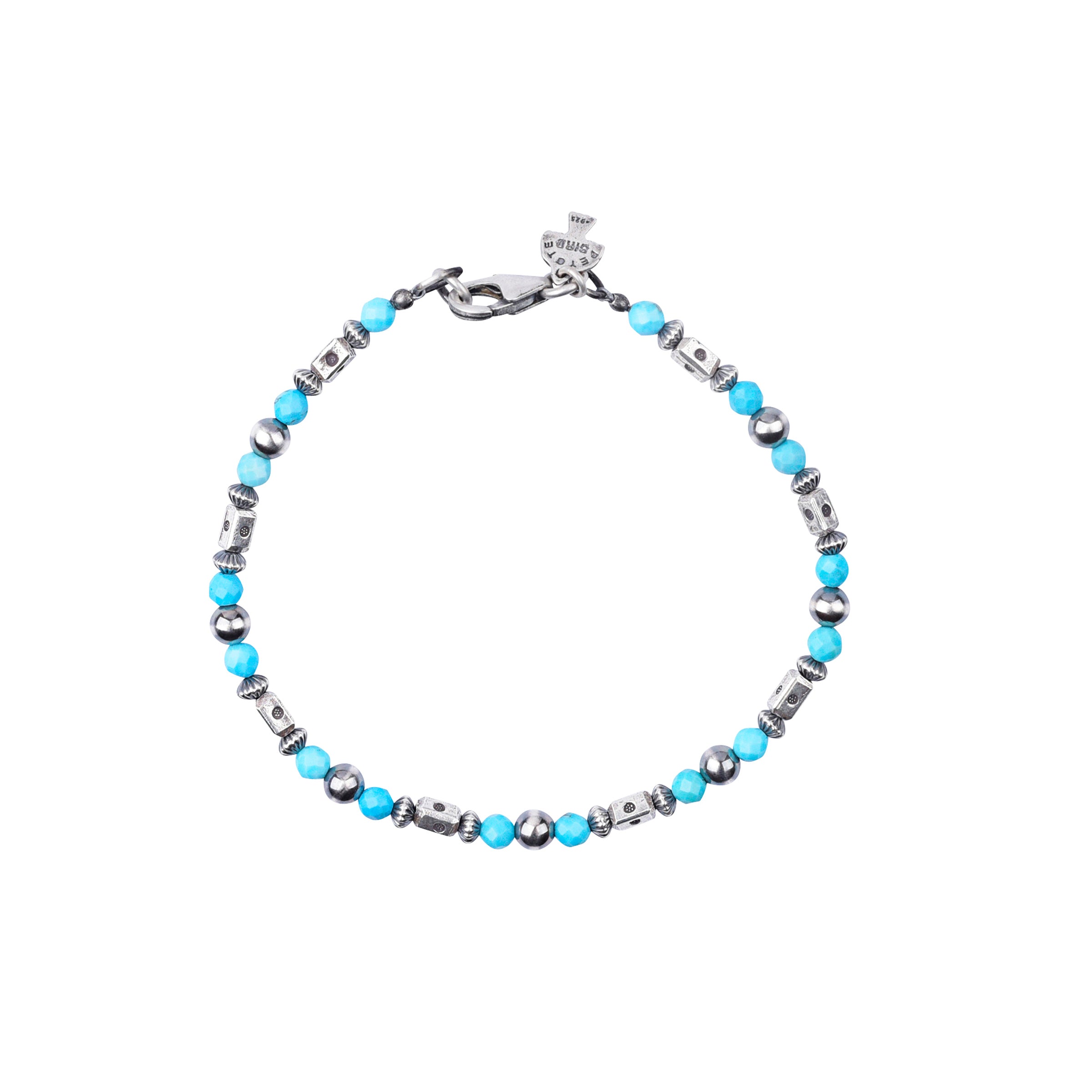 Our O'Keeffe Bracelet is adorned with desert pearls, sterling silver embellishments, and your choice of coral, pearl, or turquoise beading, or stick with just sterling silver!