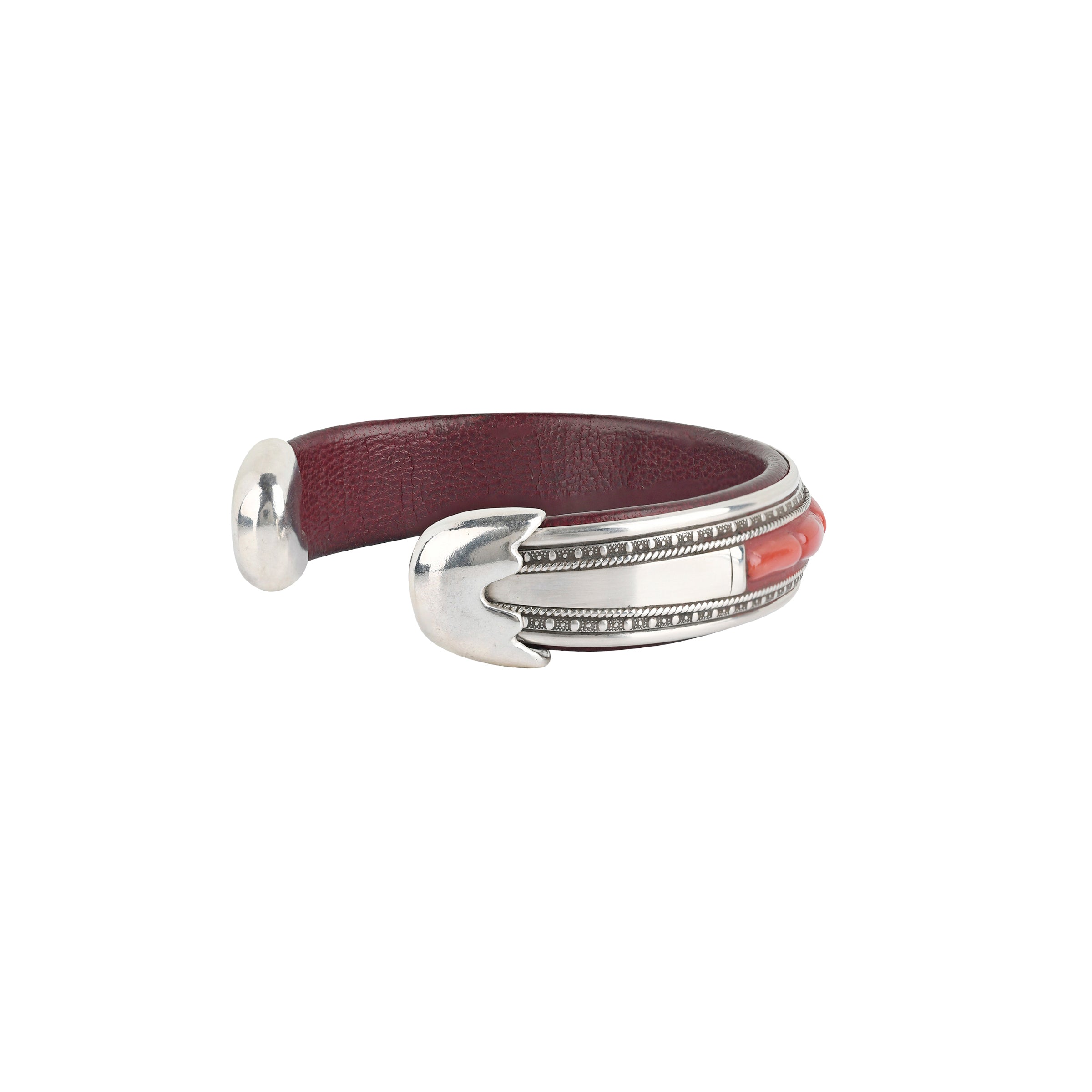 The Sangre Cuff by Charlie Favour is a leather and Sterling Silver cuff inlayed with Red Coral.