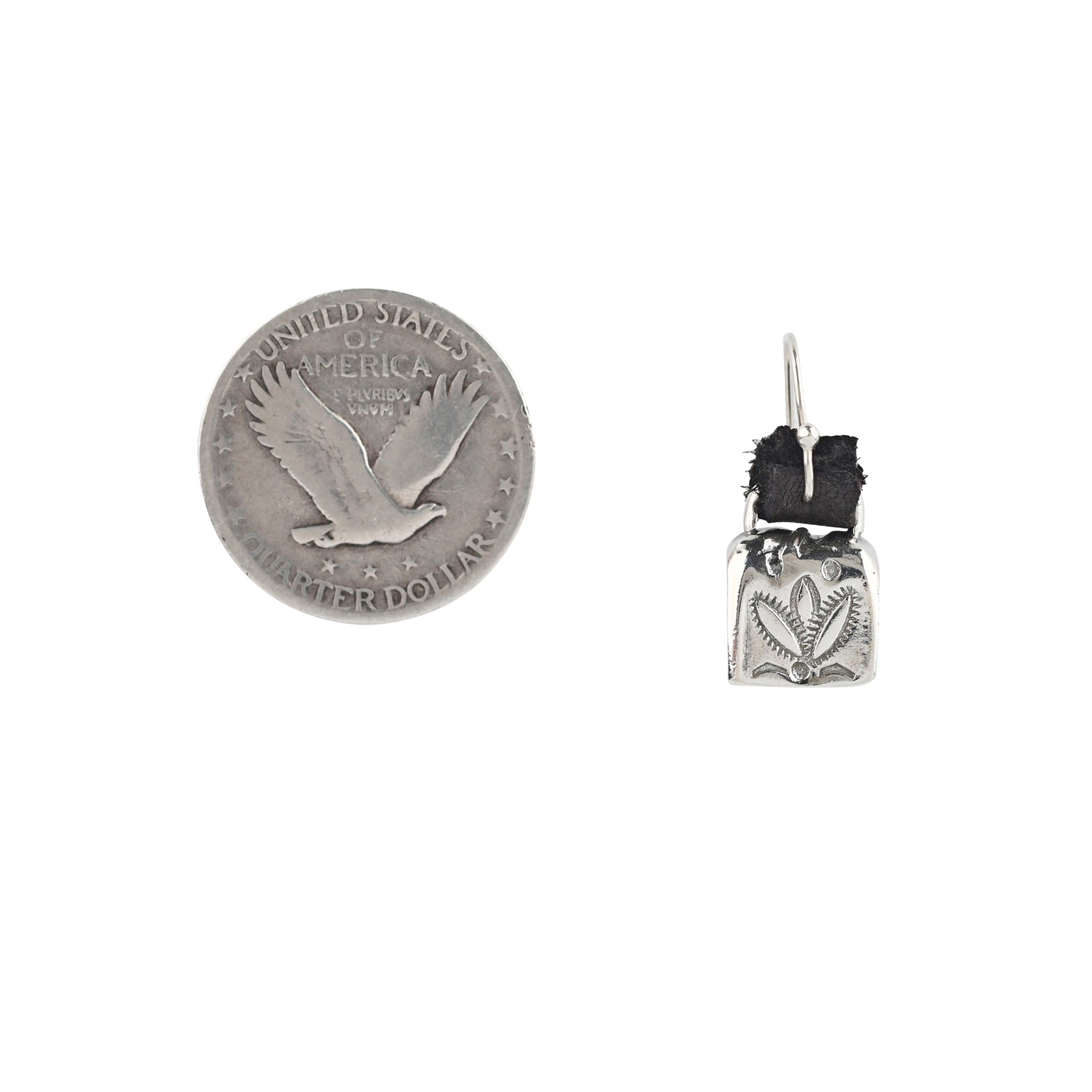 Earrings made with stamped Sterling Silver bells that actually jingle! Stamped with a Santa Fe Style floral desert design. Hung with brown, soft deerskin leather.