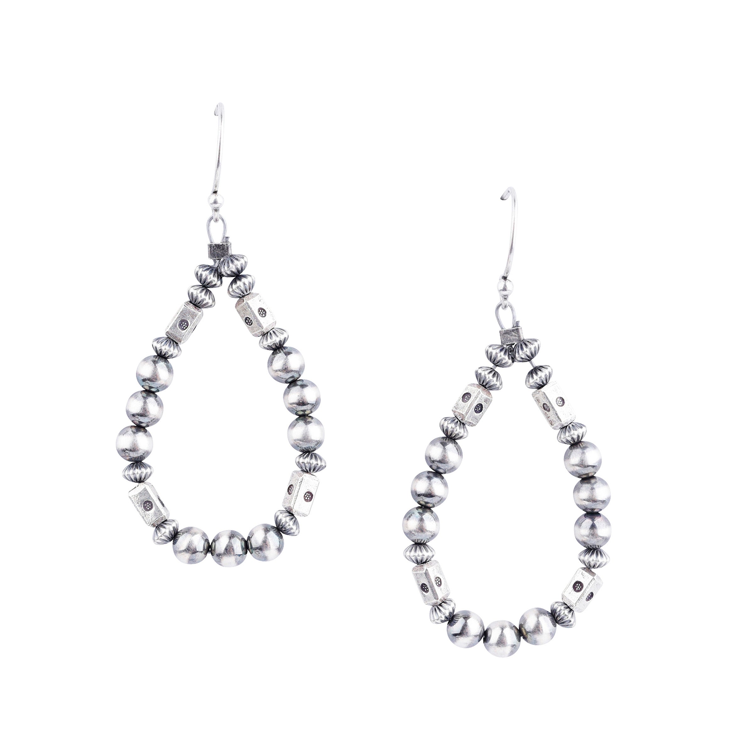 Our O'Keeffe Earrings are adorned with desert pearls, sterling silver embellishments, and your choice of coral, pearl, or turquoise beading, or stick with just sterling silver!