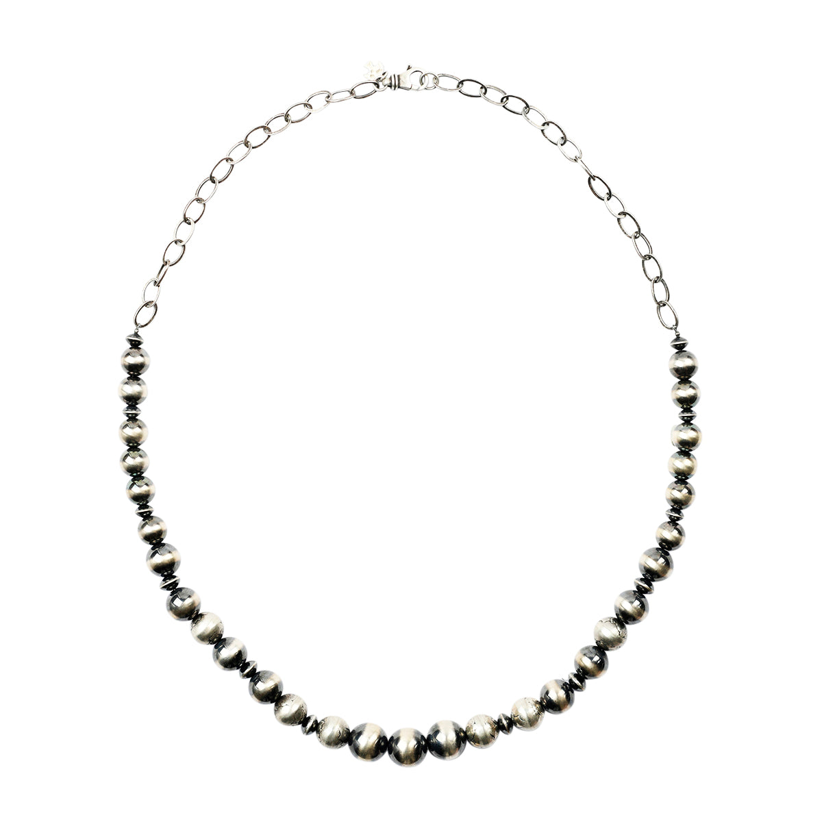 A vintage inspired beaded necklace featuring mercury dime beads and desert pearls on chain.