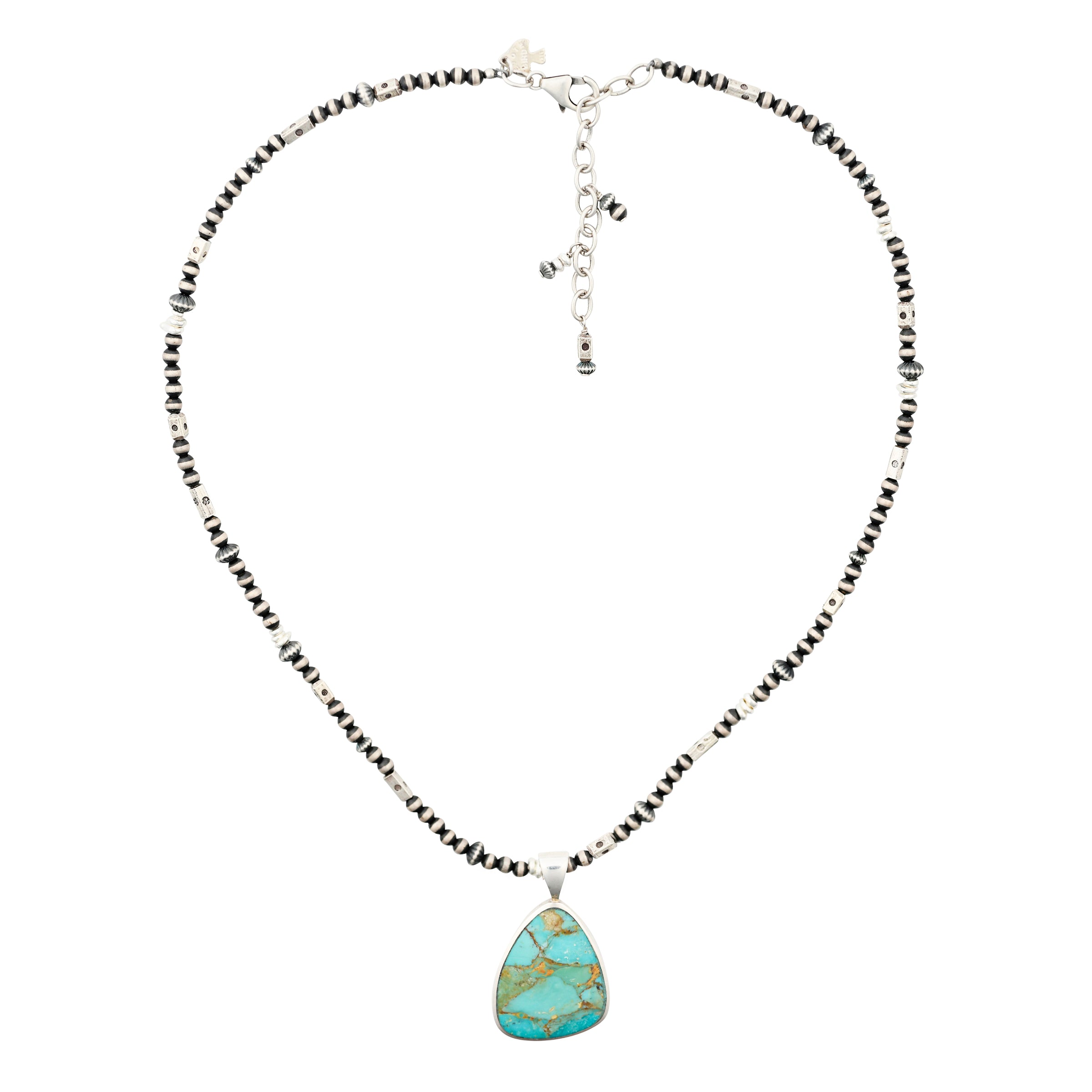 A beaded necklace featuring Desert Pearls, stamped Sterling Silver Thai beading and a pendant of an irregular shape of Turquoise in Sterling Silver.