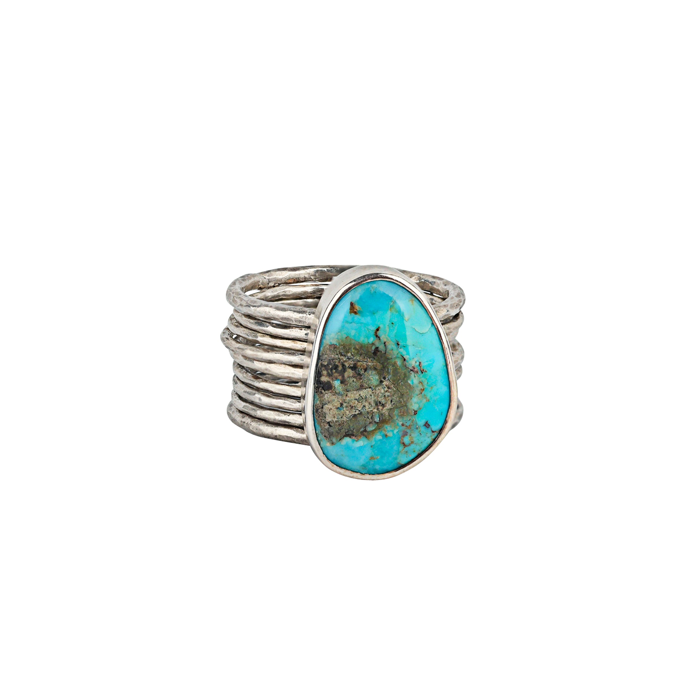 A Turquoise Ring with thin Sterling Silver bands that move with your finger.