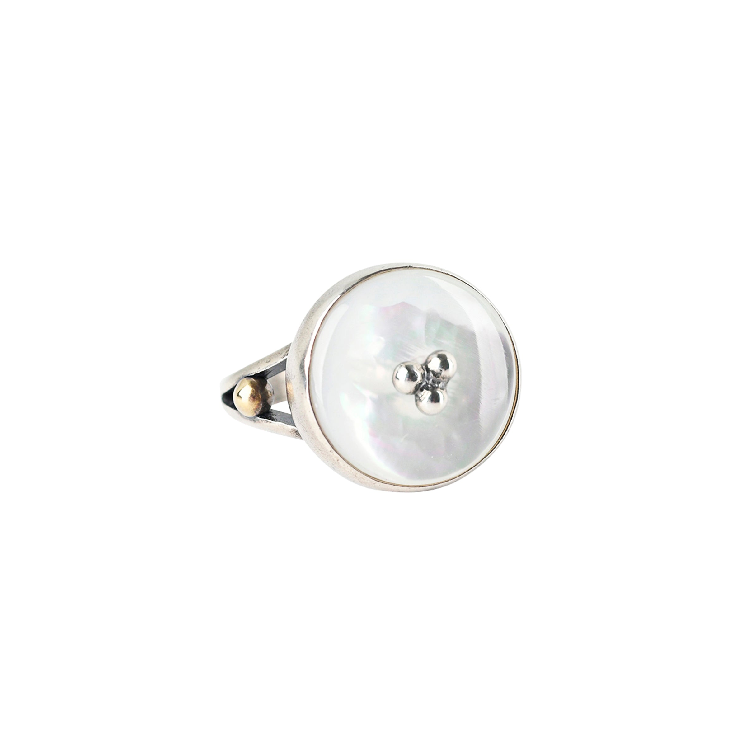 A Mother of Pearl Ring with Sterling Silver dotting as the centerpiece set in Sterling Silver with 14k Gold Plate detailing