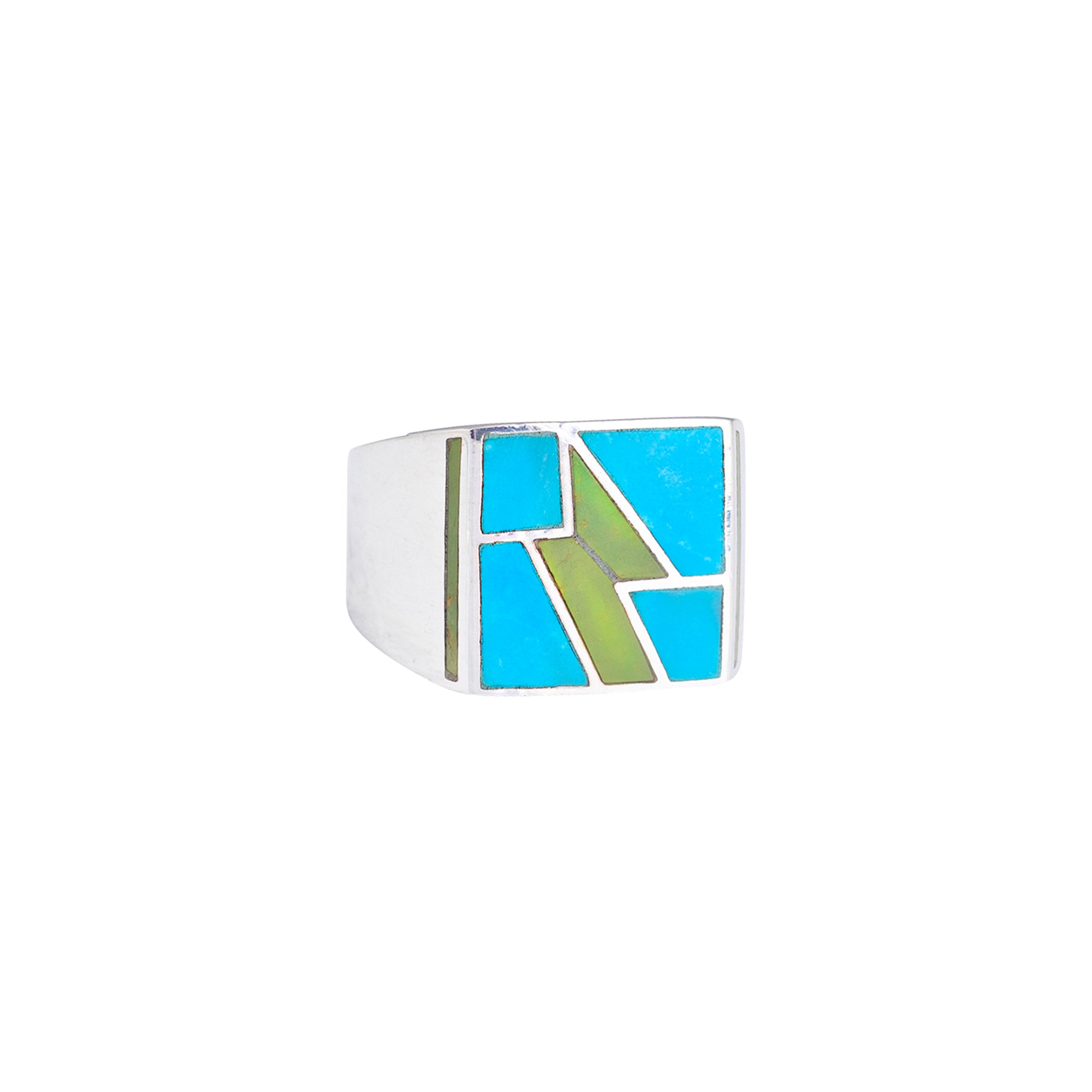 A Sterling Silver ring inlayed with Blue Turquoise and Green Turquoise