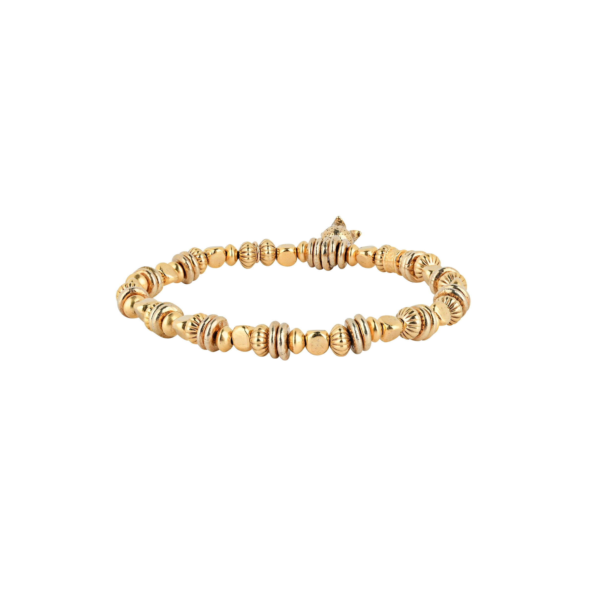 A beaded stretch bracelet strung with 14k Gold Plate beading with stamped detailing, topped with a small gold plated floral blossom.