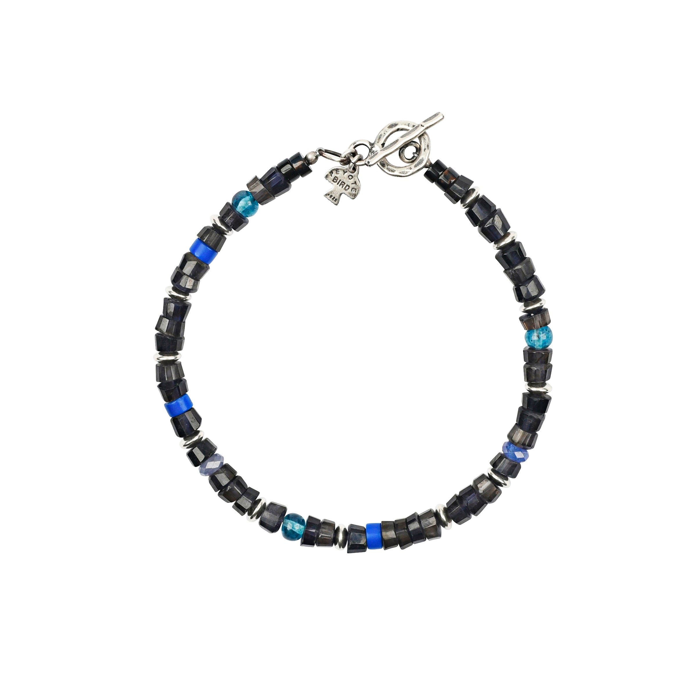 The Amaranth bracelet is hand strung with sterling silver, howlite, iolite and blue tigers eye and tanzanite. 