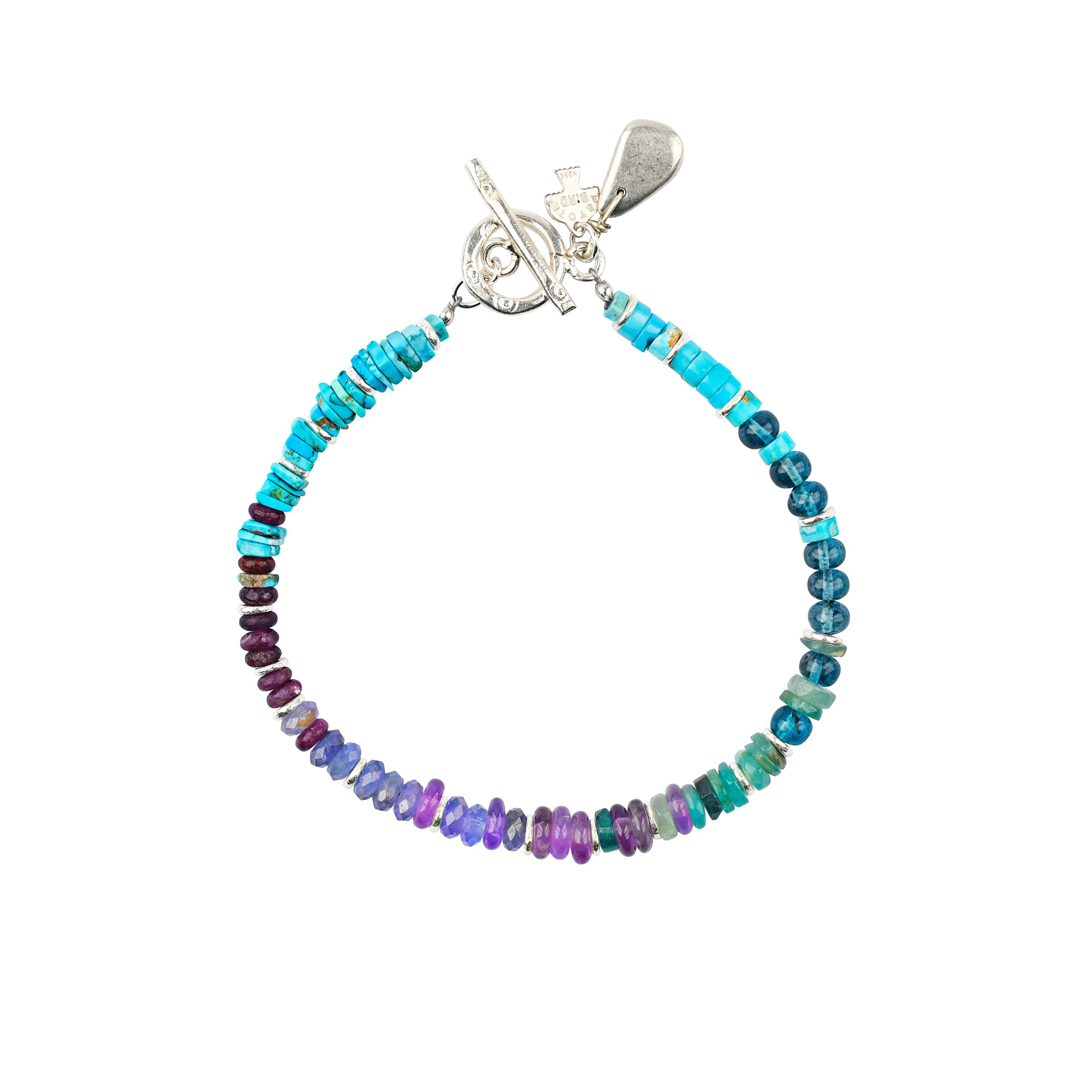 Beaded bracelet with Blue Turquoise, Quartz, Tanzanite, and Sterling Silver, with a sterling silver toggle closure.
