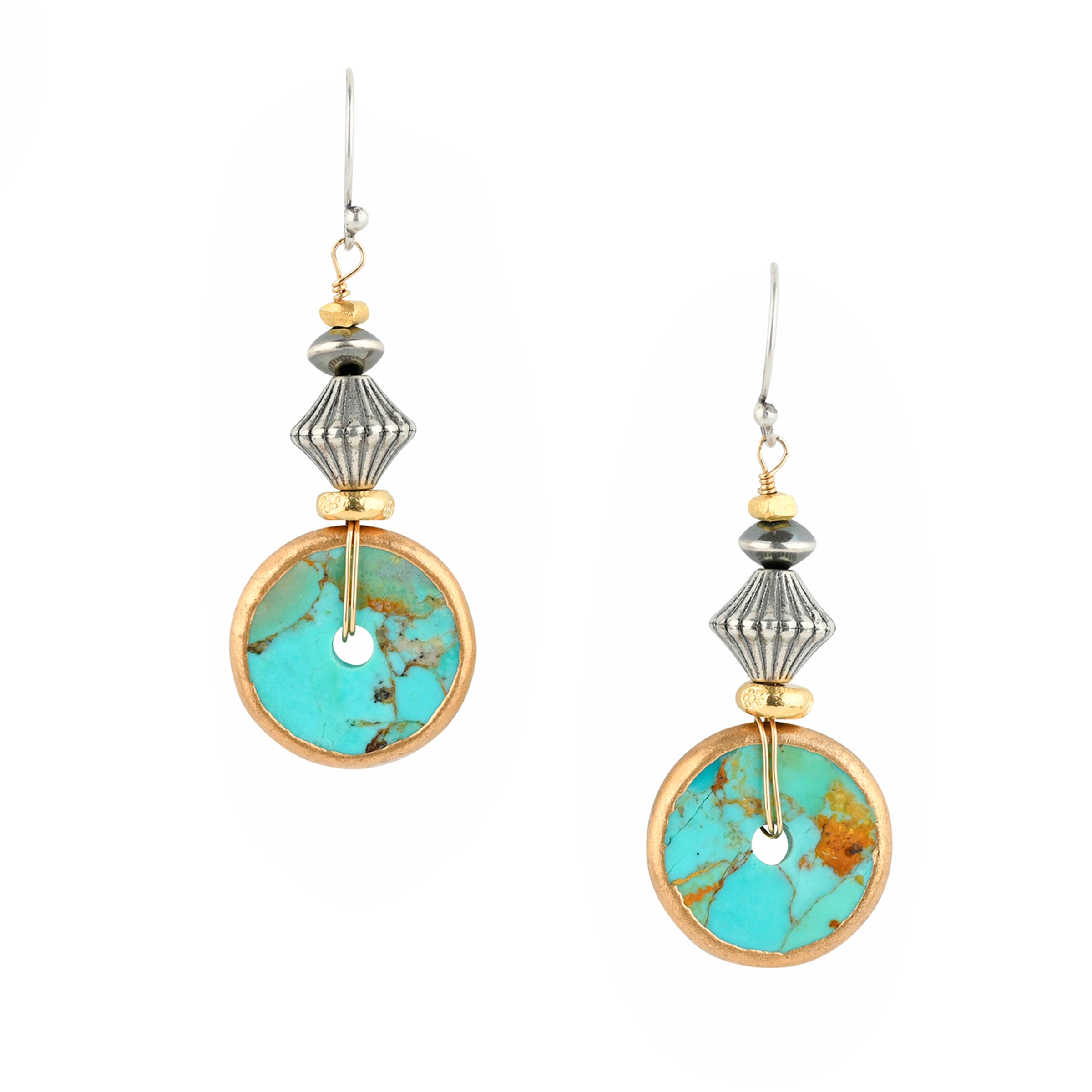 A little twist on the classic Turquoise Disc Earrings, the Turquoise Tide Earrings are adorned with 14k Gold Plated stamped Thai beading accompanied with a decorative addition of Desert Pearl Saucers and a simple stamped Sterling Silver bead.&nbsp;