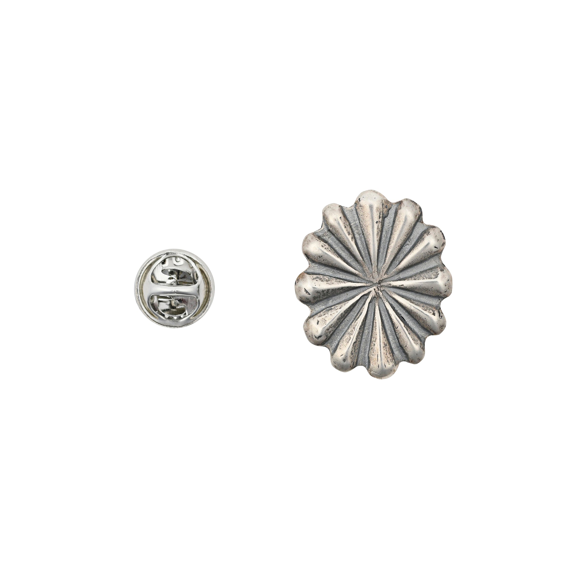Sterling silver raised concho pin next to pin back. 