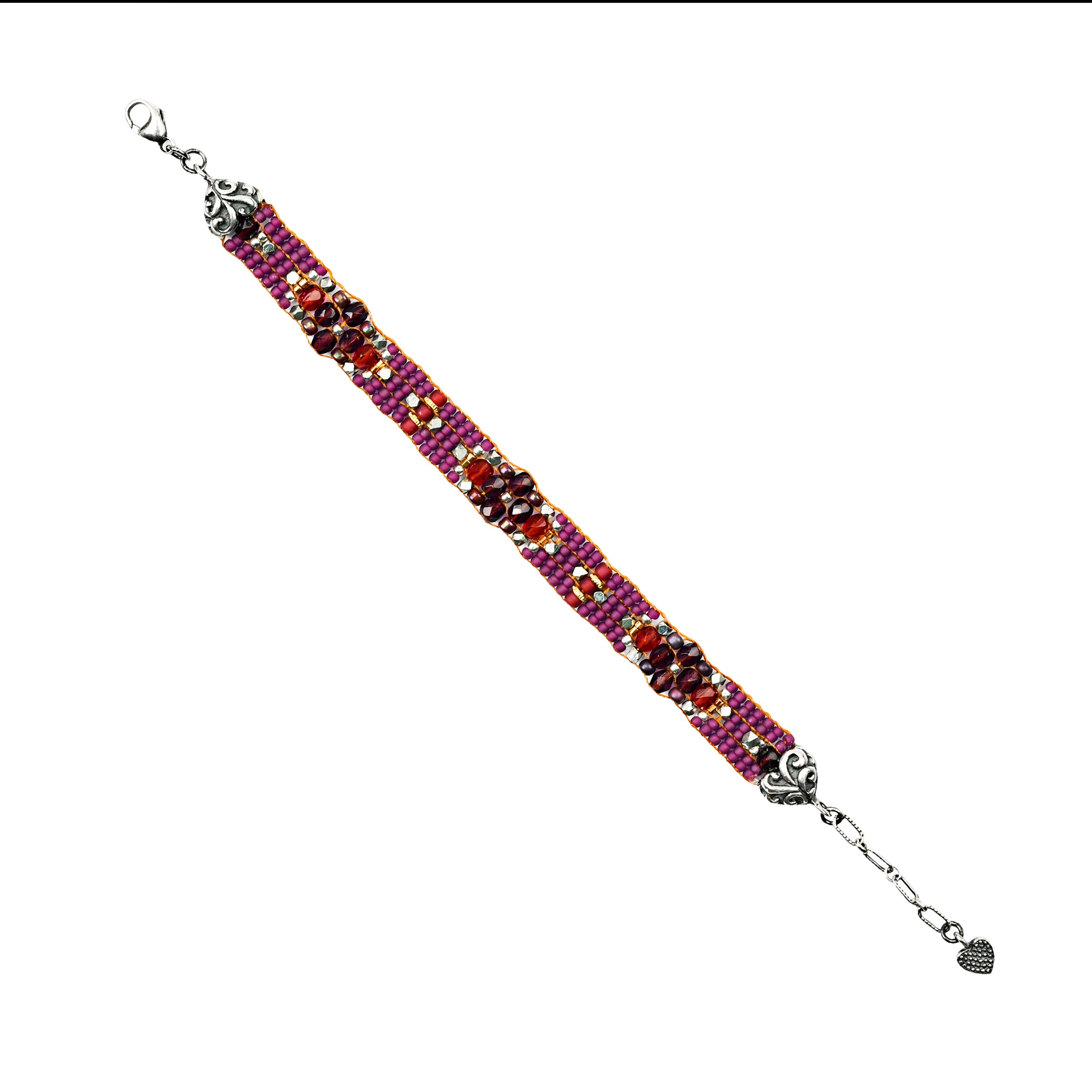 Hand loomed bracelet in purple and red tones with sterling silver end caps and lobster claw closure with extender chain. 