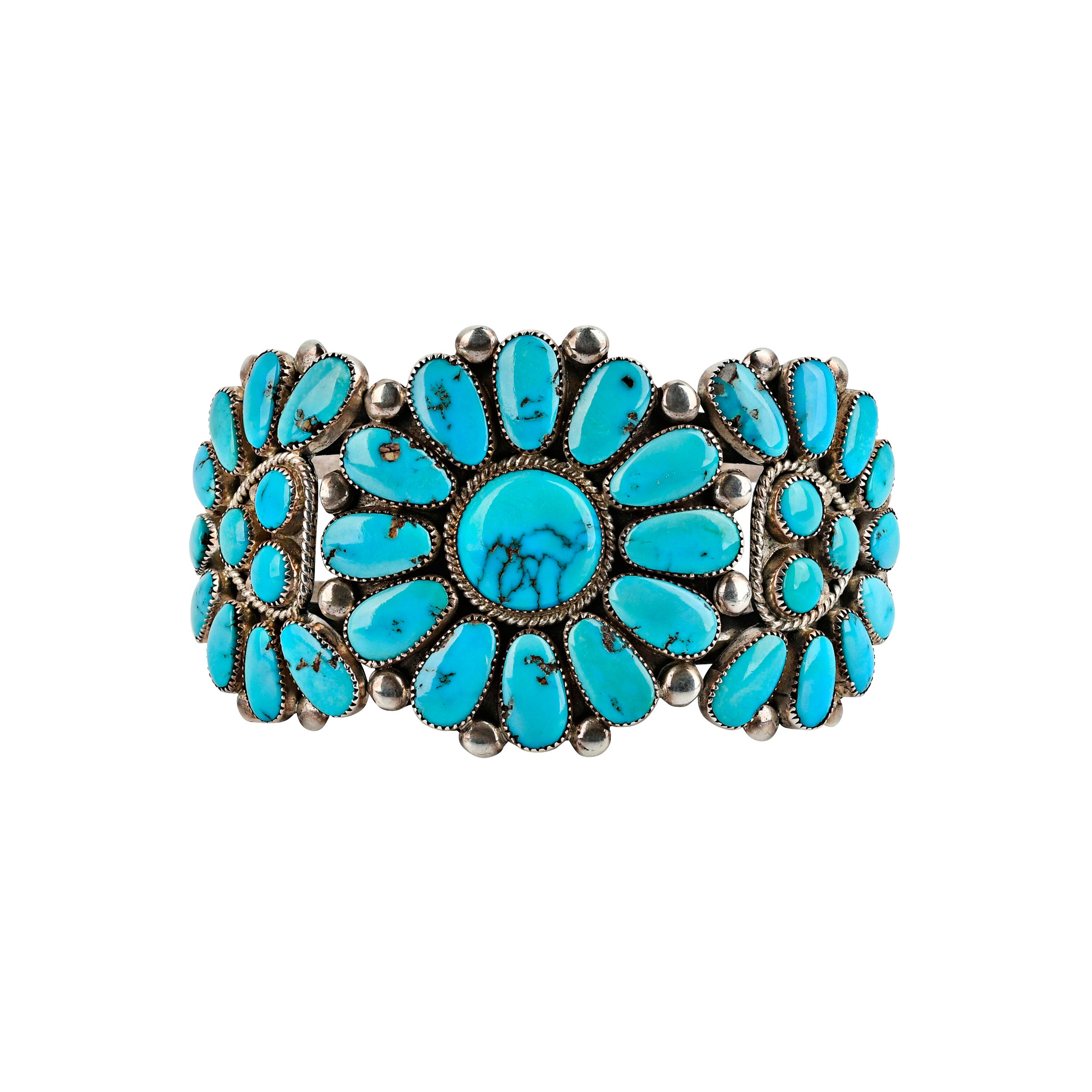 Flower motif in turquoise cuff