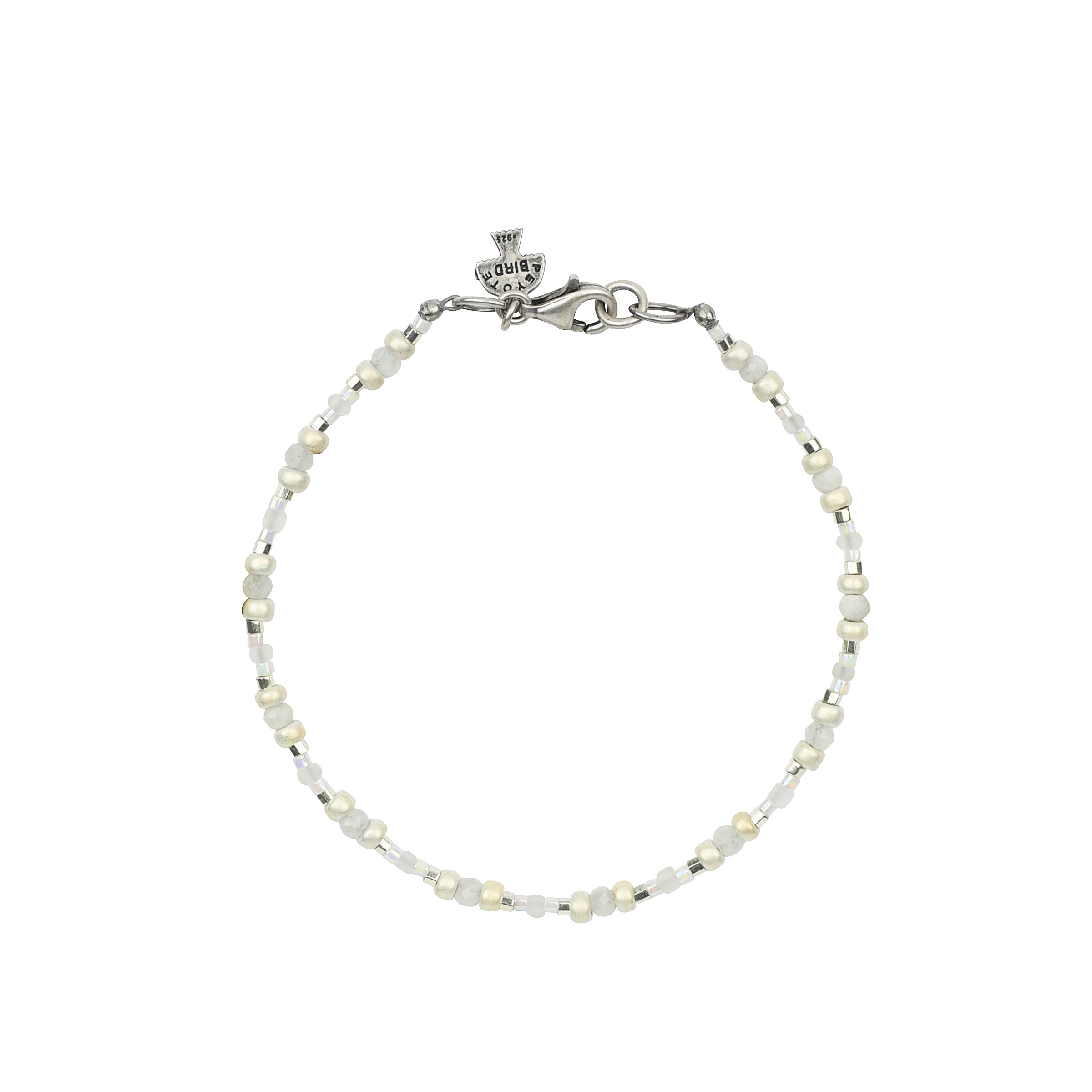 Beaded bracelet in white tone with sterling silver lobster claw clasp. 
