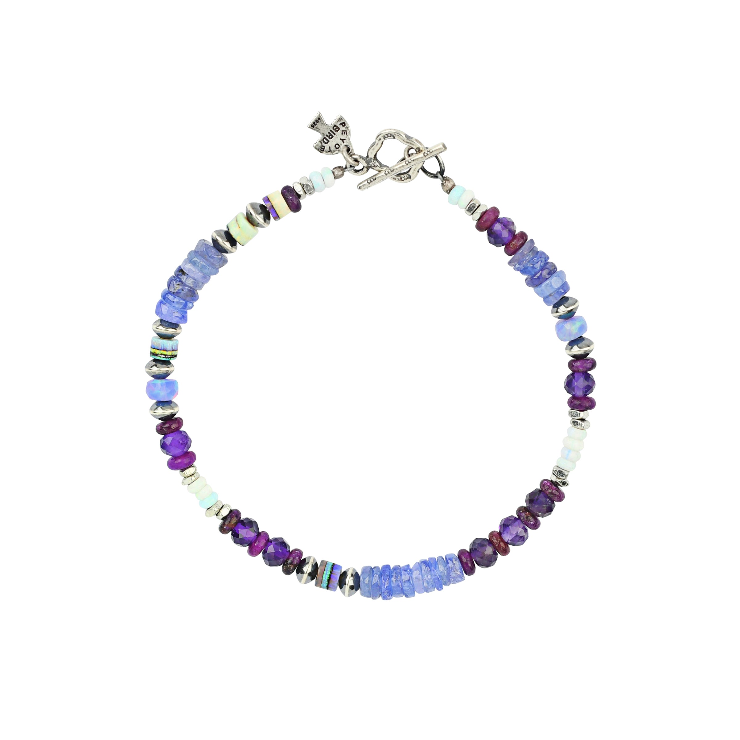 Beaded bracelet with blues and purples and sterling silver toggle closure. 