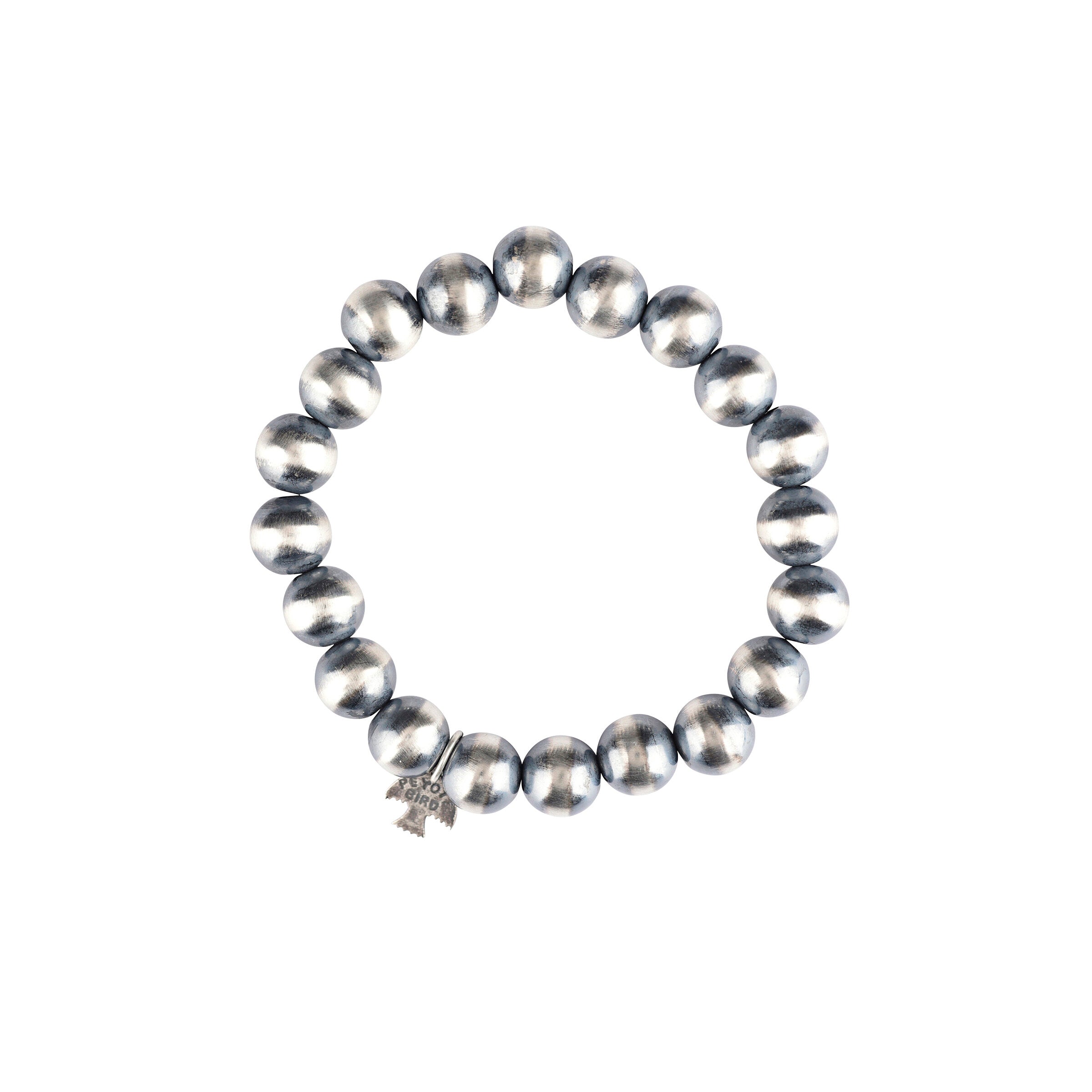 A stretch bracelet featuring round sterling silver beads representing the 'Desert Pearl' style.