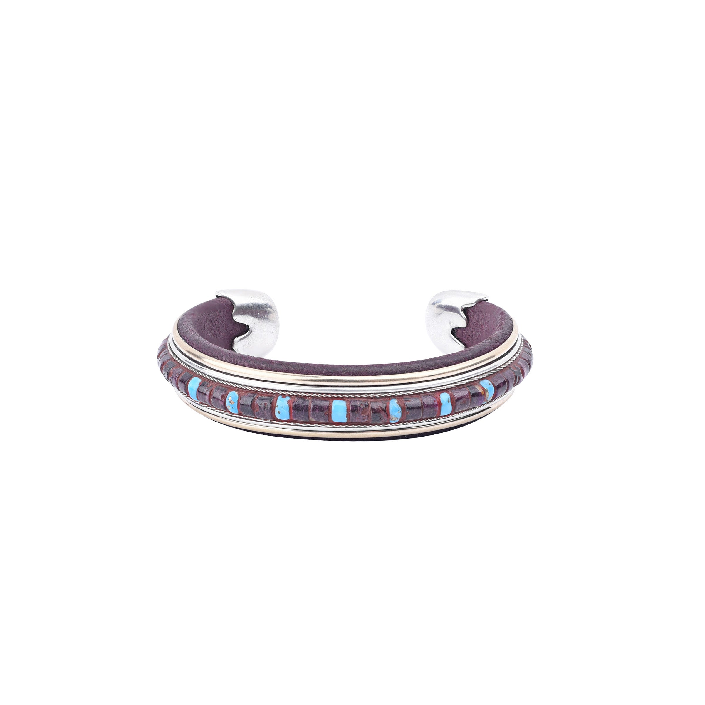 The Mystic Cuff from artist Ramona Heise features soft leather, sterling silver, with blue turquoise stones and purple spiny oyster shell. Made in USA 