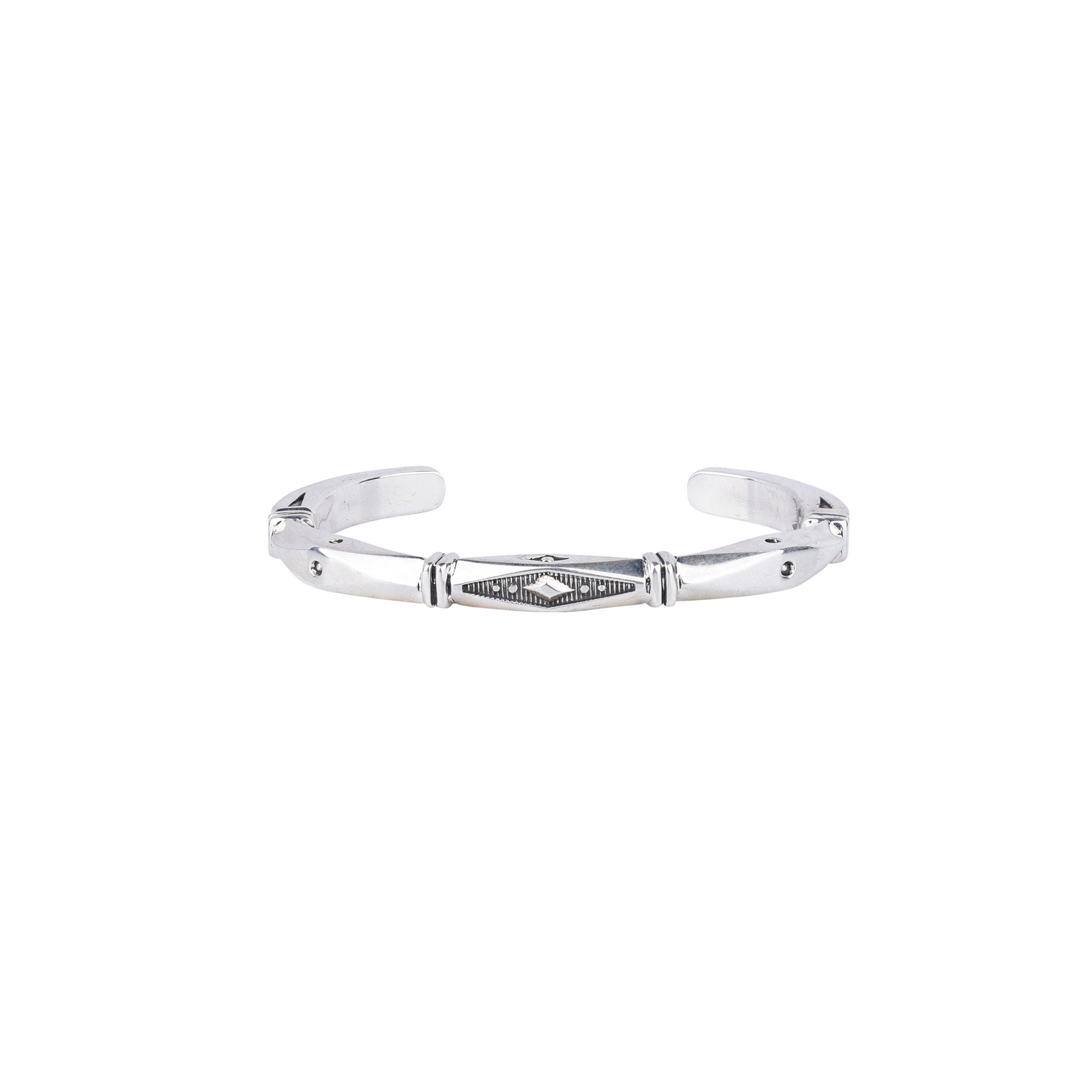 Sterling silver cuff bracelet with diamond shaped stamp work.