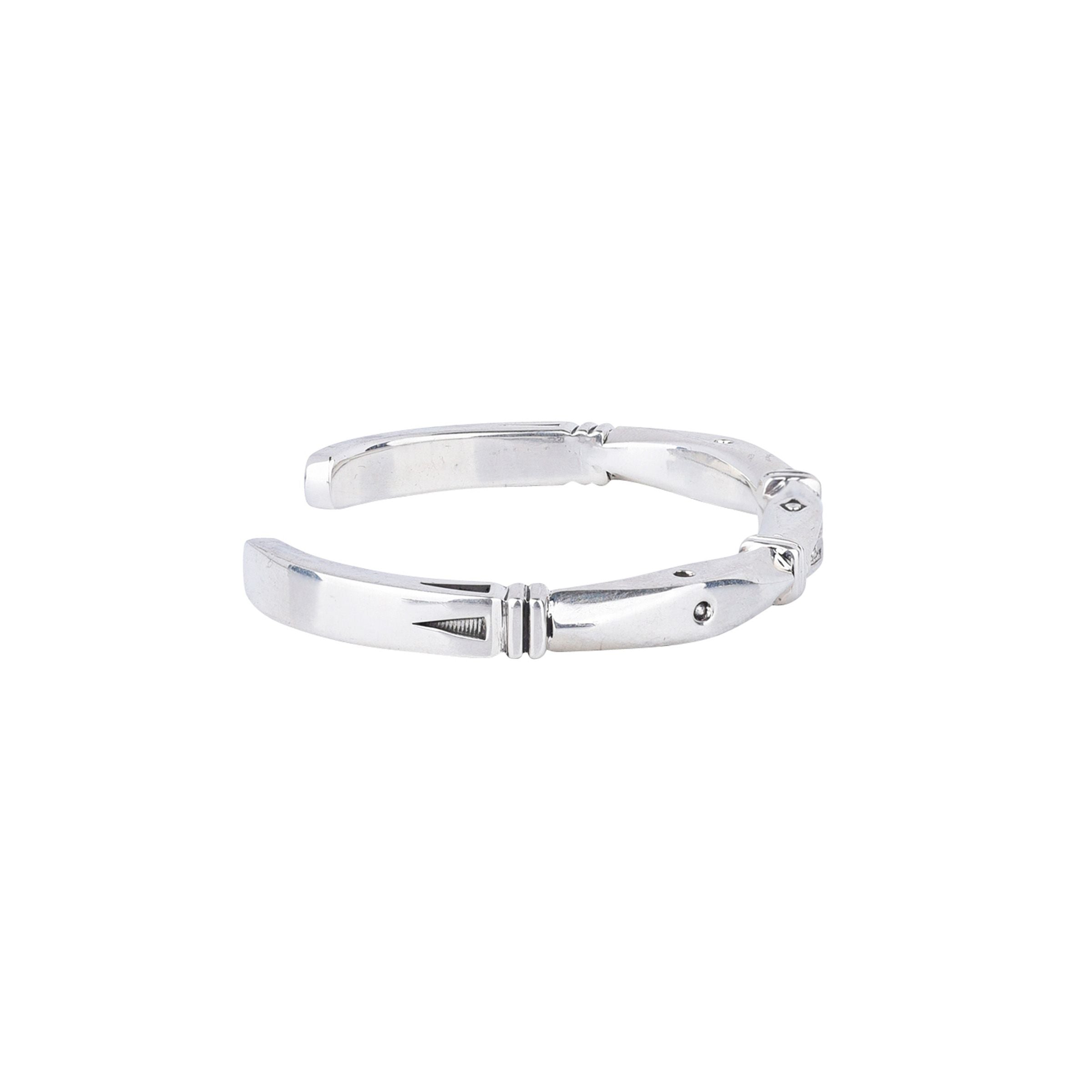 Sterling silver cuff bracelet with diamond shaped stamp work.