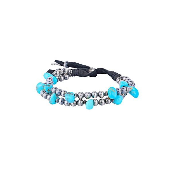 An adjustable bracelet with turquoise nuggets and sterling silver desert pearls, featuring deerskin leather.